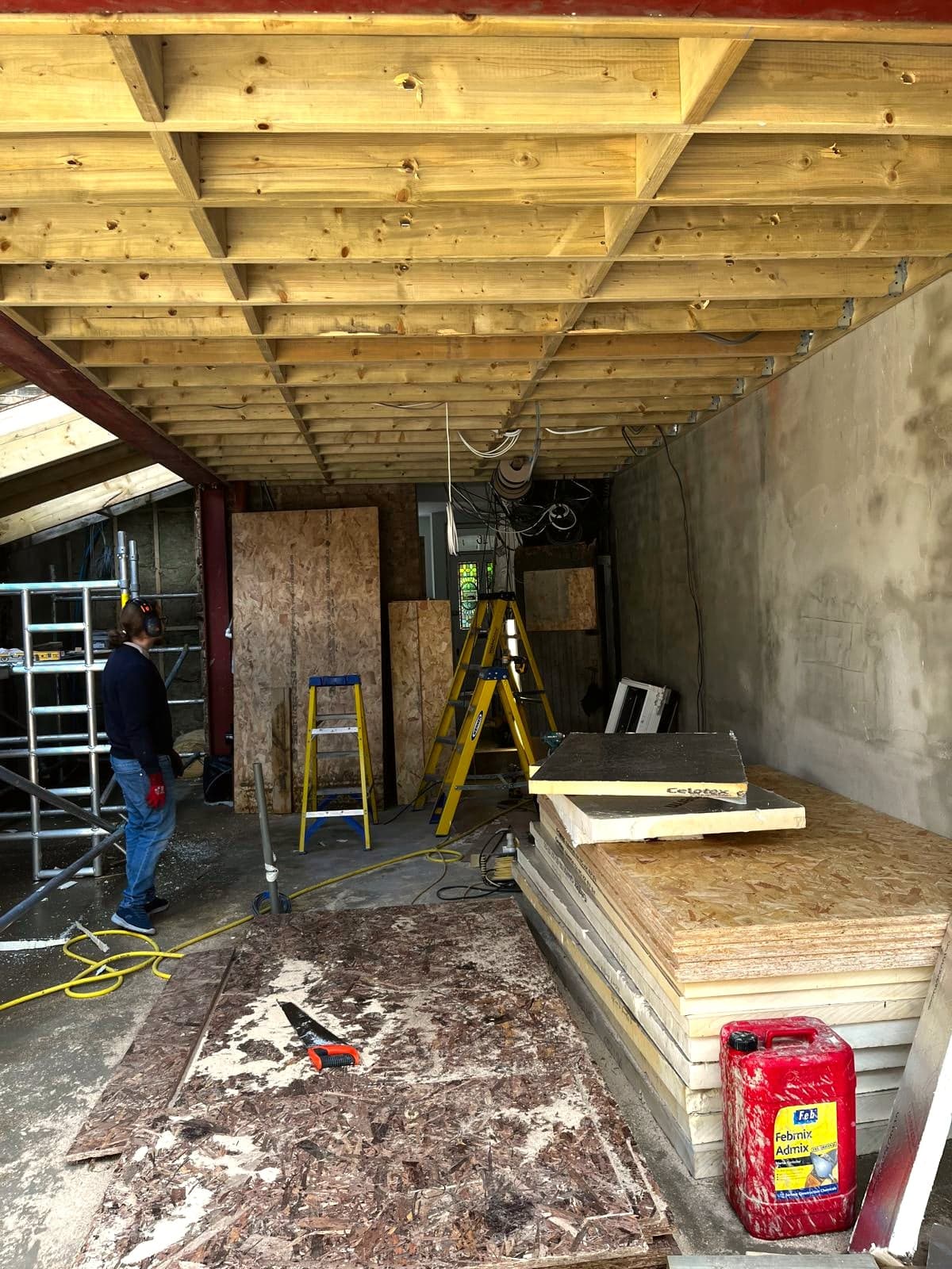 Roof decked over the extension shell and made weathertight, London extension