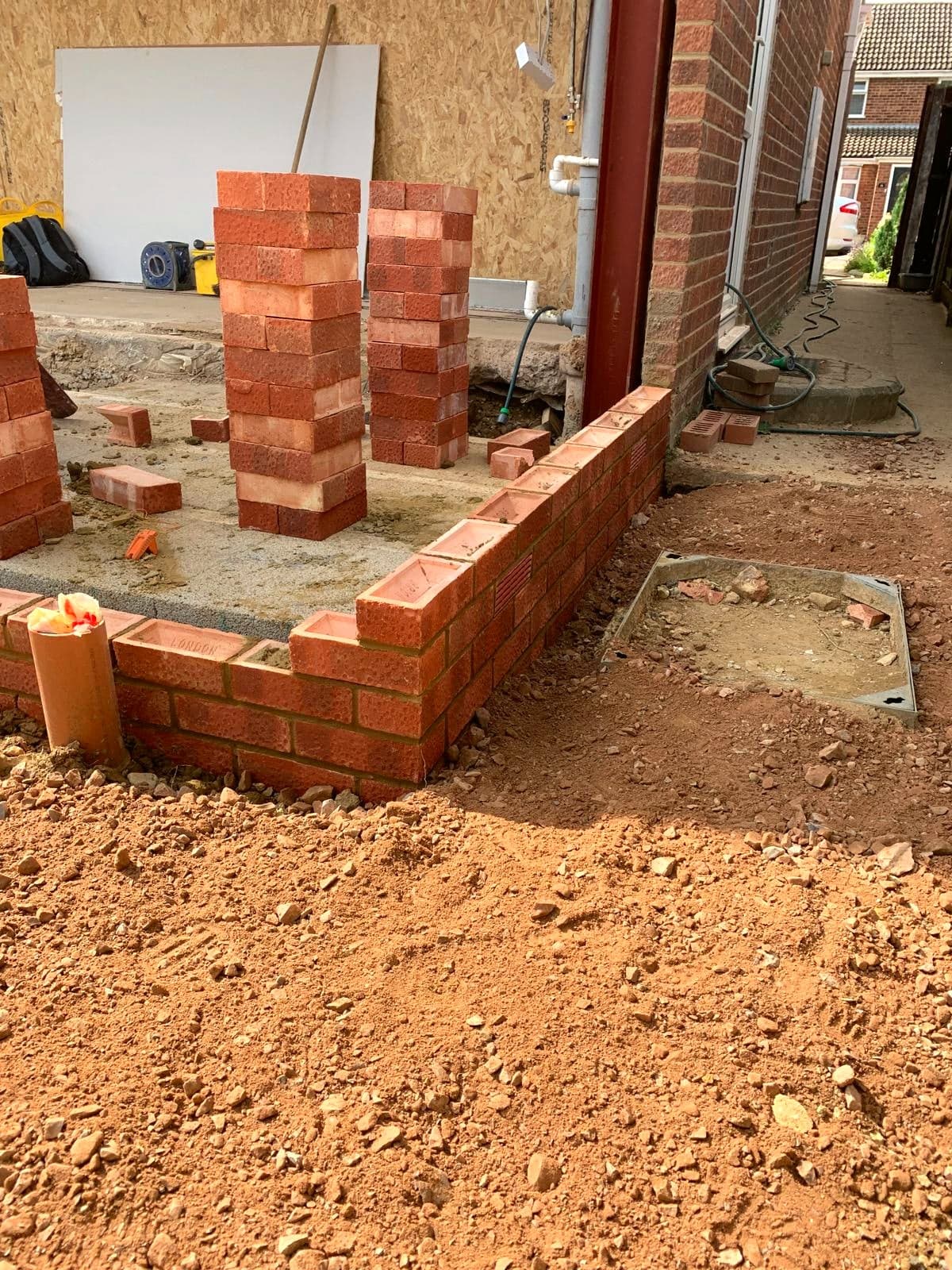 Brick walls and piers rising off the foundations, London extension