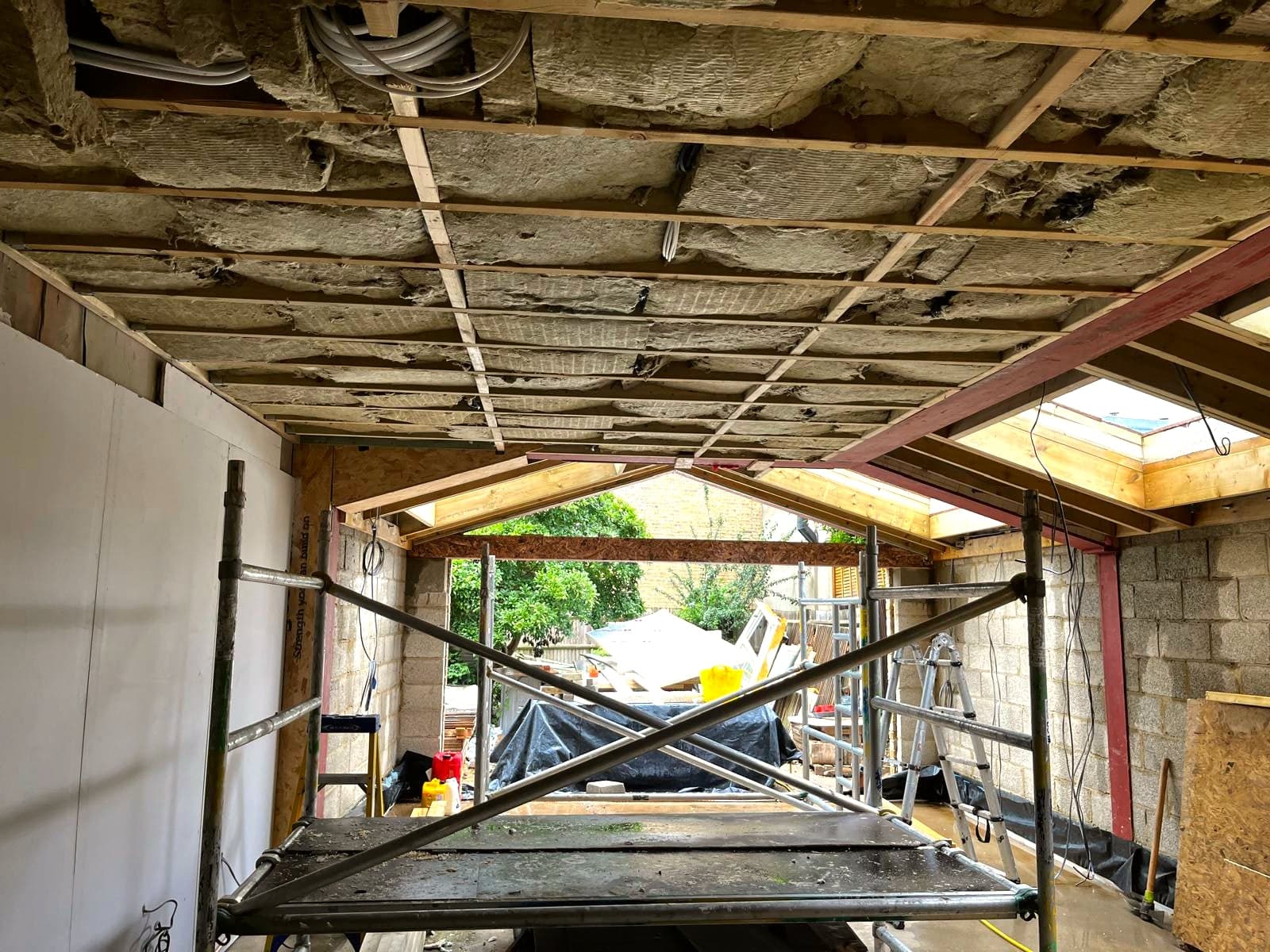 Steel beam and roof joists spanning the new opening, London extension