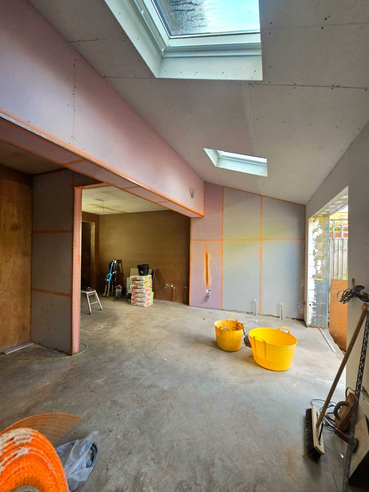 Extension ceiling boarded and skimmed around the rooflight, London