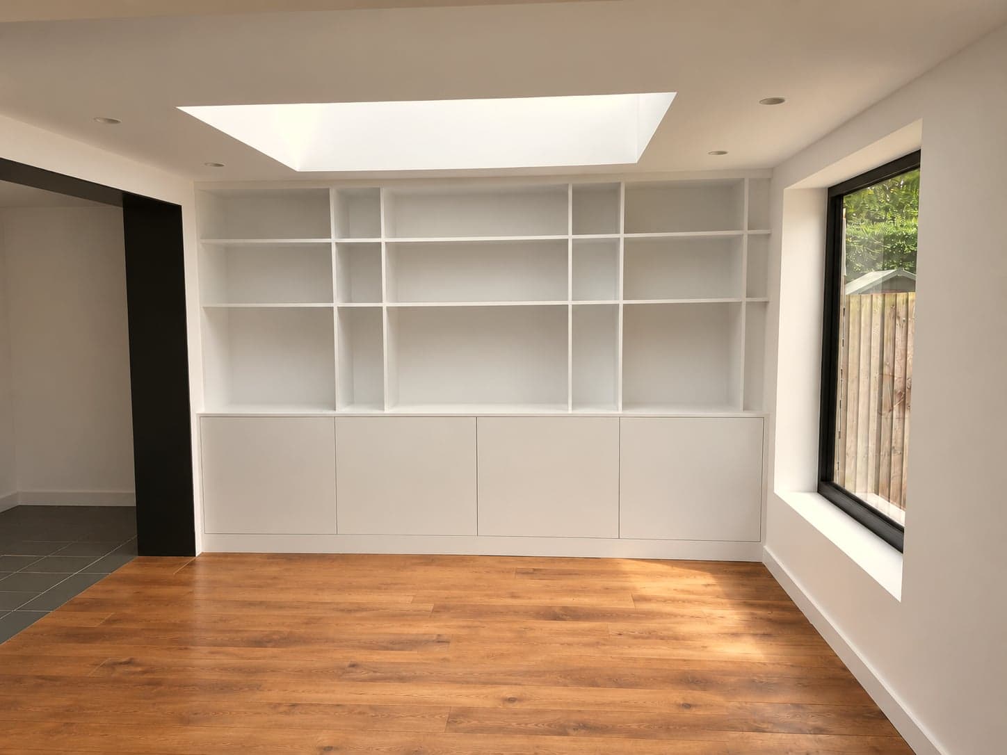 Bespoke built-in shelving and cabinetry in a finished extension, London