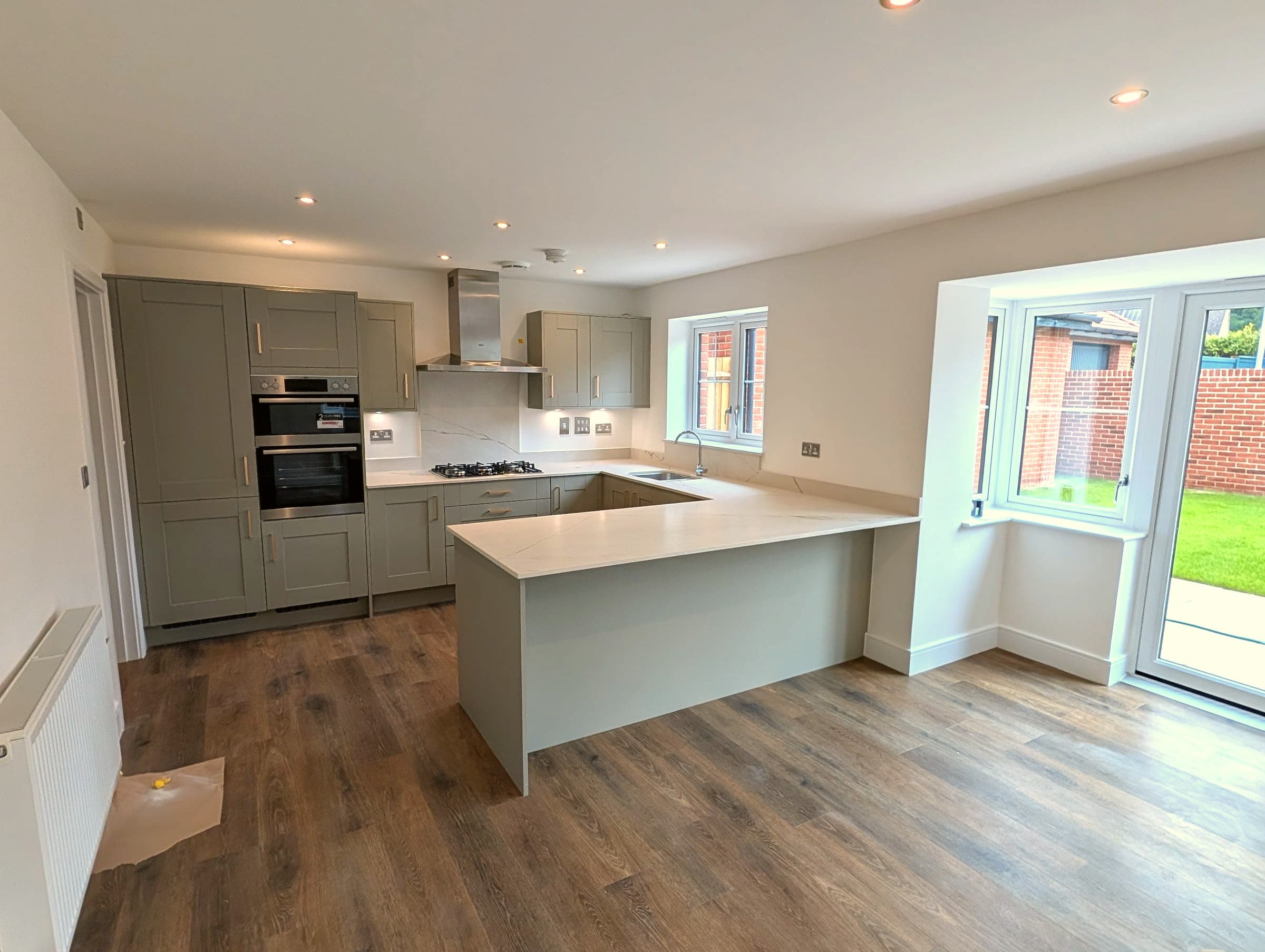 Sage shaker kitchen renovation with island, London