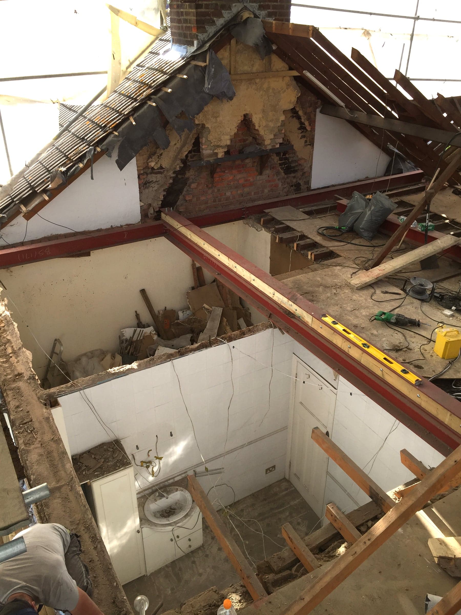 Roof covering stripped back during a loft conversion, London