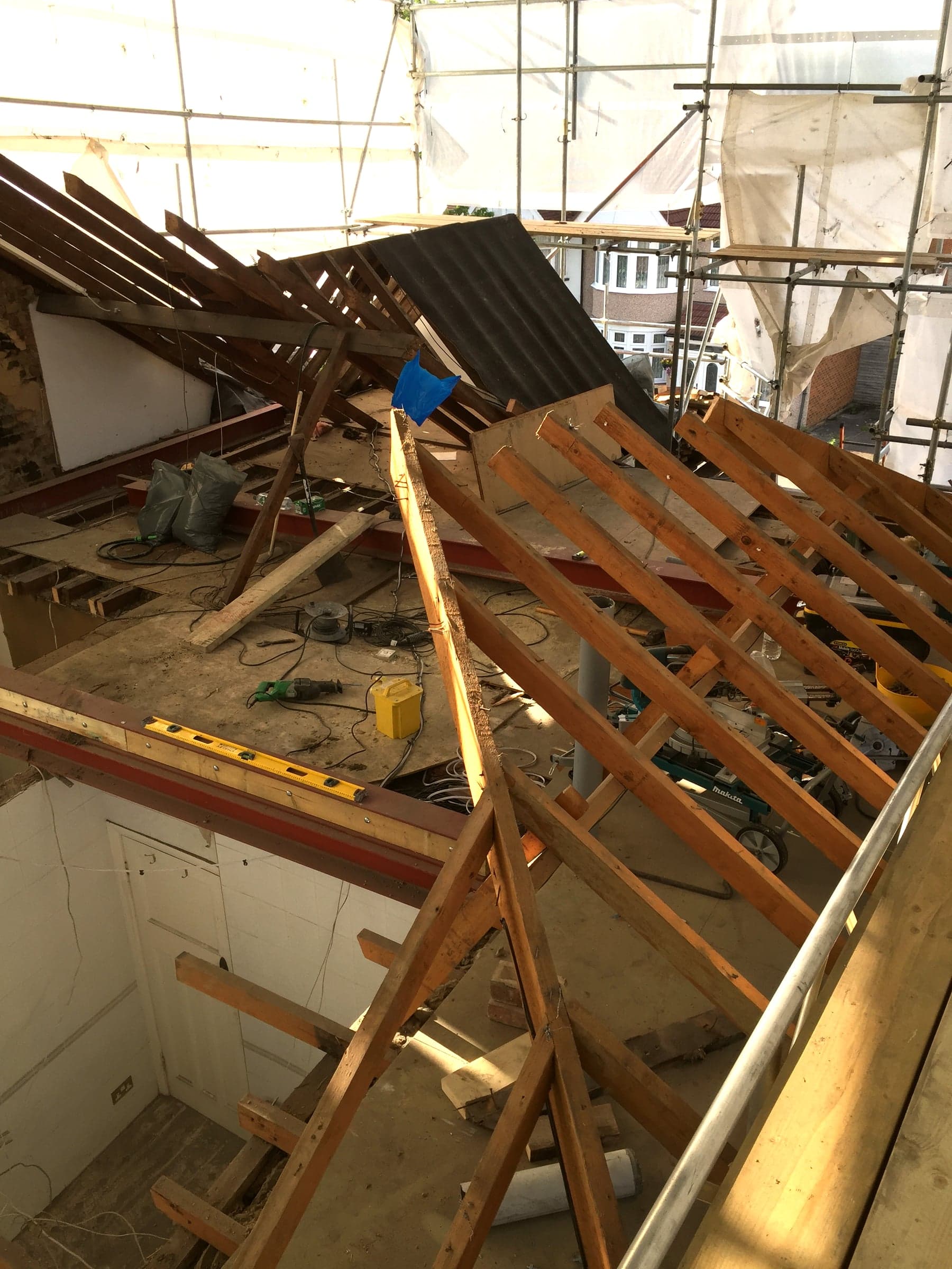 Chimney breast exposed and retained during a loft conversion, London