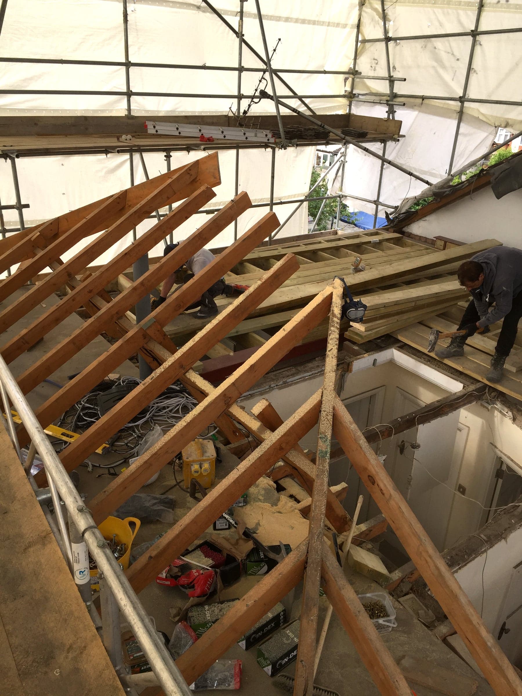 Scaffold debris netting and site hoarding for a loft conversion, London