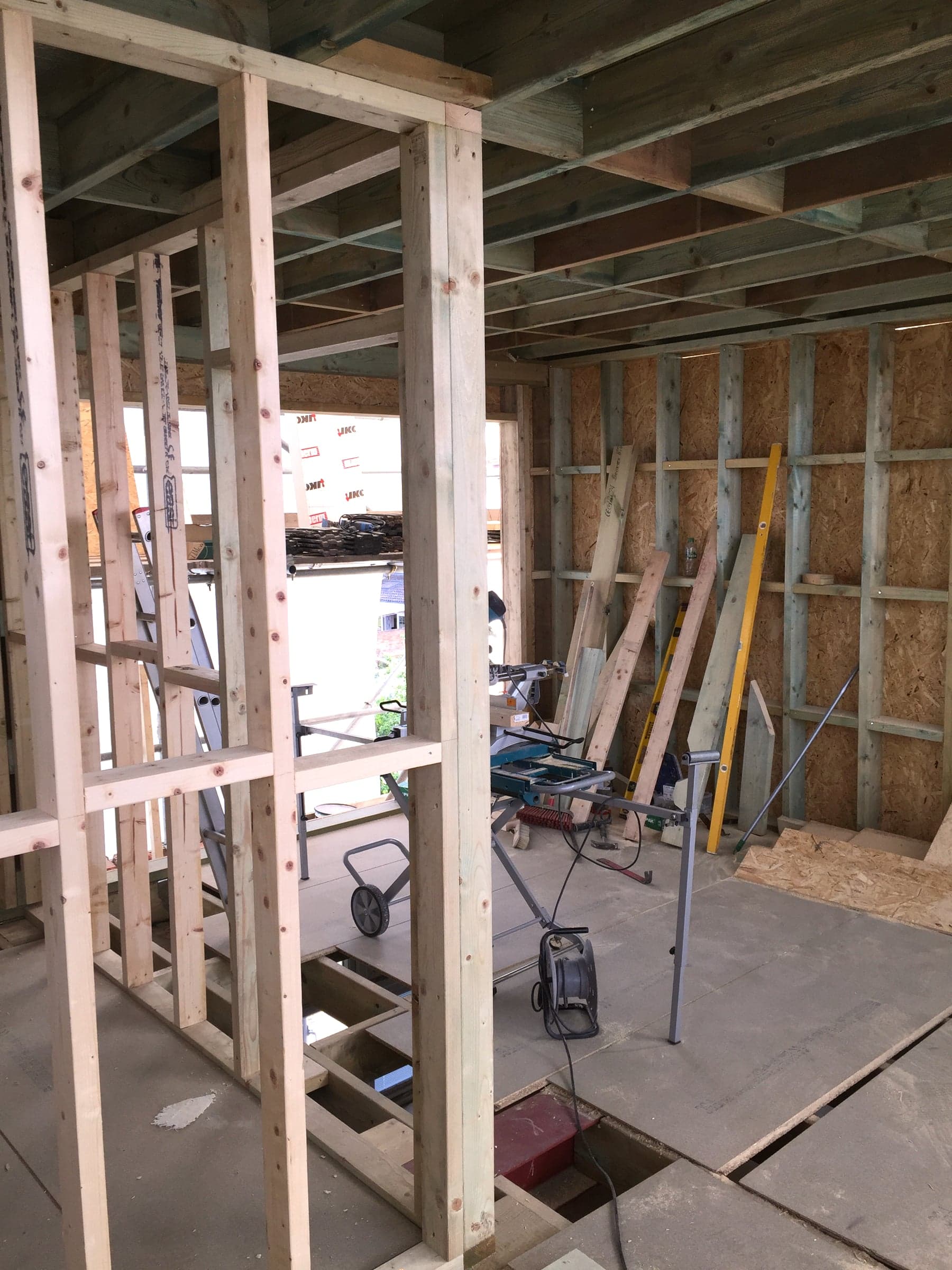 Internal stud partitions sheathed in OSB during a loft conversion, London