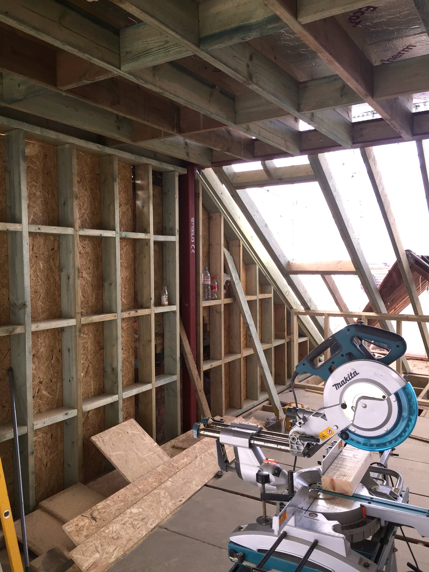 Under-purlin eaves storage framed during a loft conversion, London