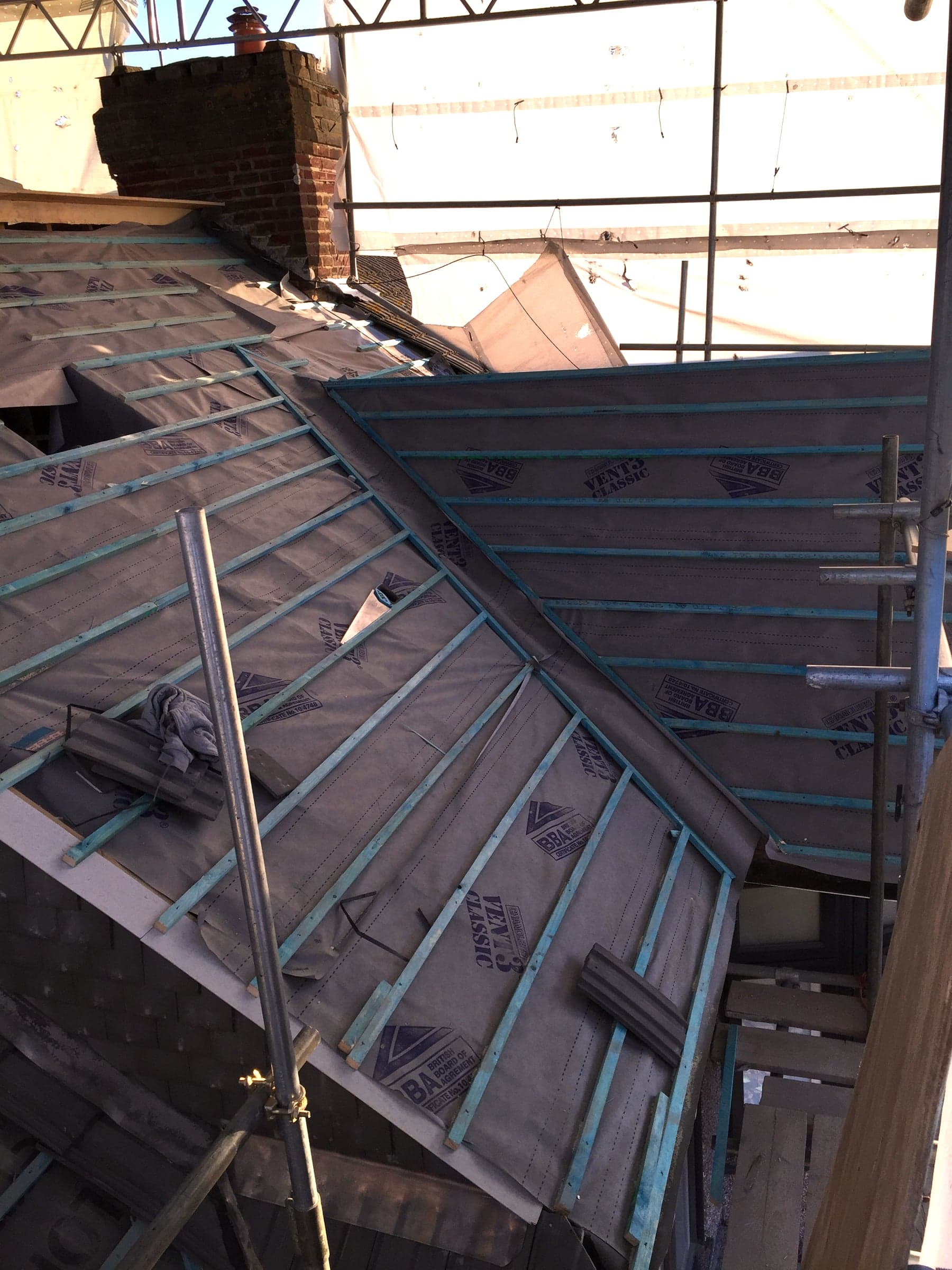 Lead flashing dressed in around a chimney, London loft conversion