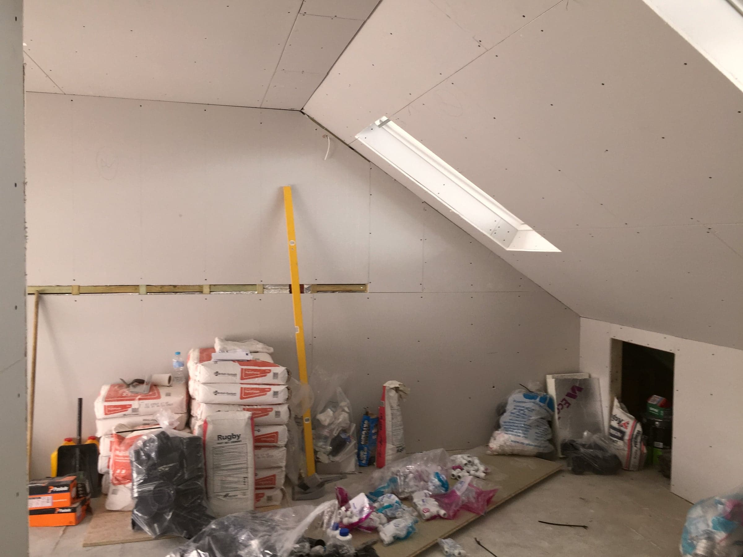 Plasterboard and Velux reveals during a loft conversion, London