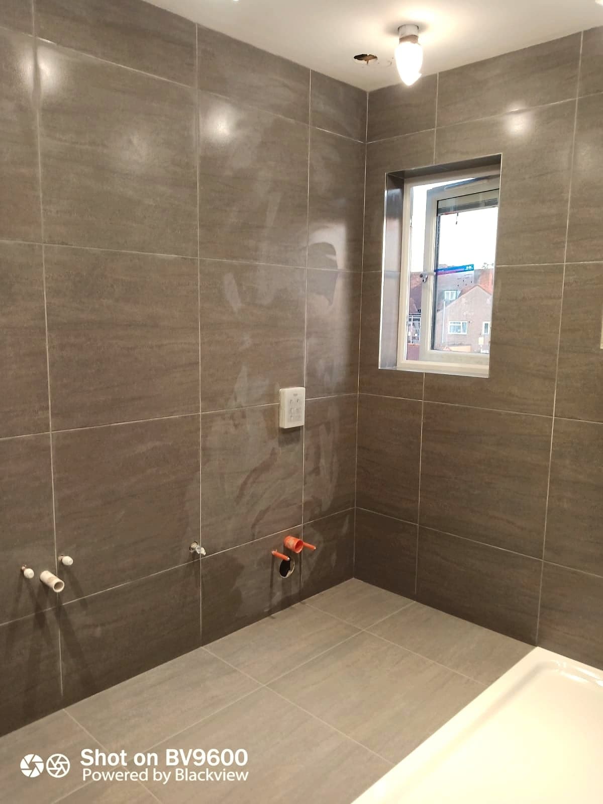 Second bathroom mid-tiling, London loft conversion