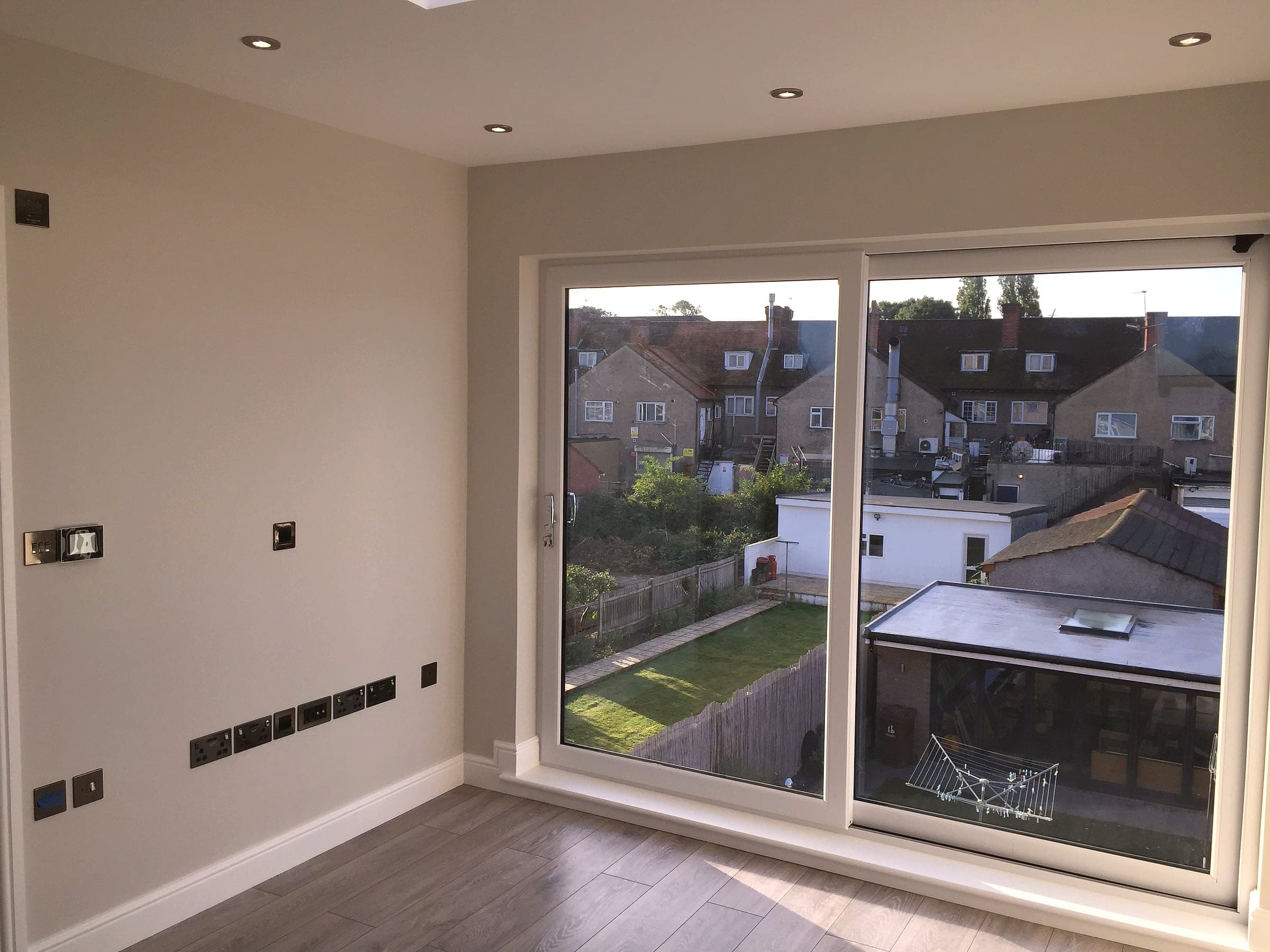 Finished flooring and LED-lit eaves storage, London loft conversion