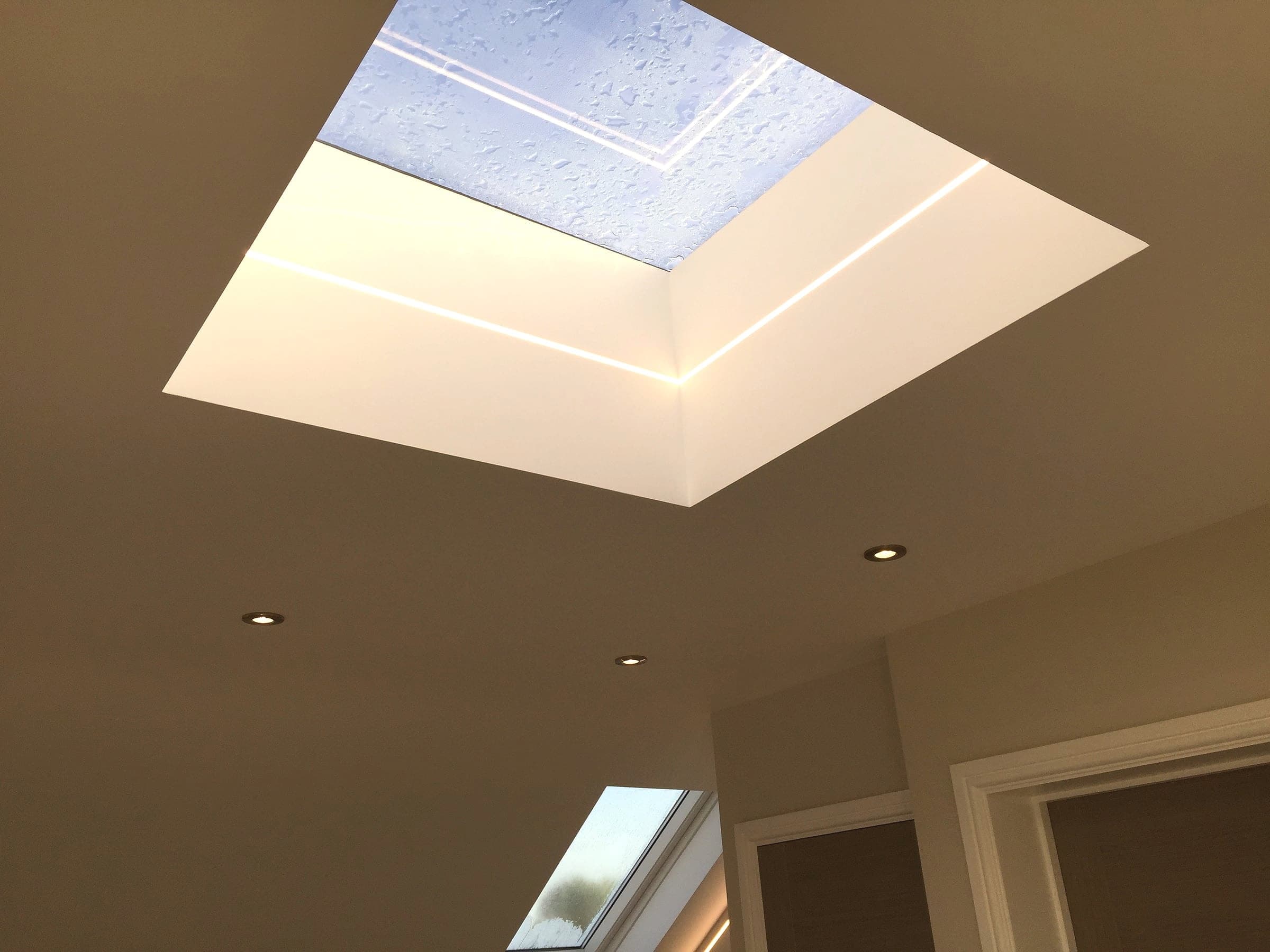 Flat rooflight with LED trim lighting, London loft conversion