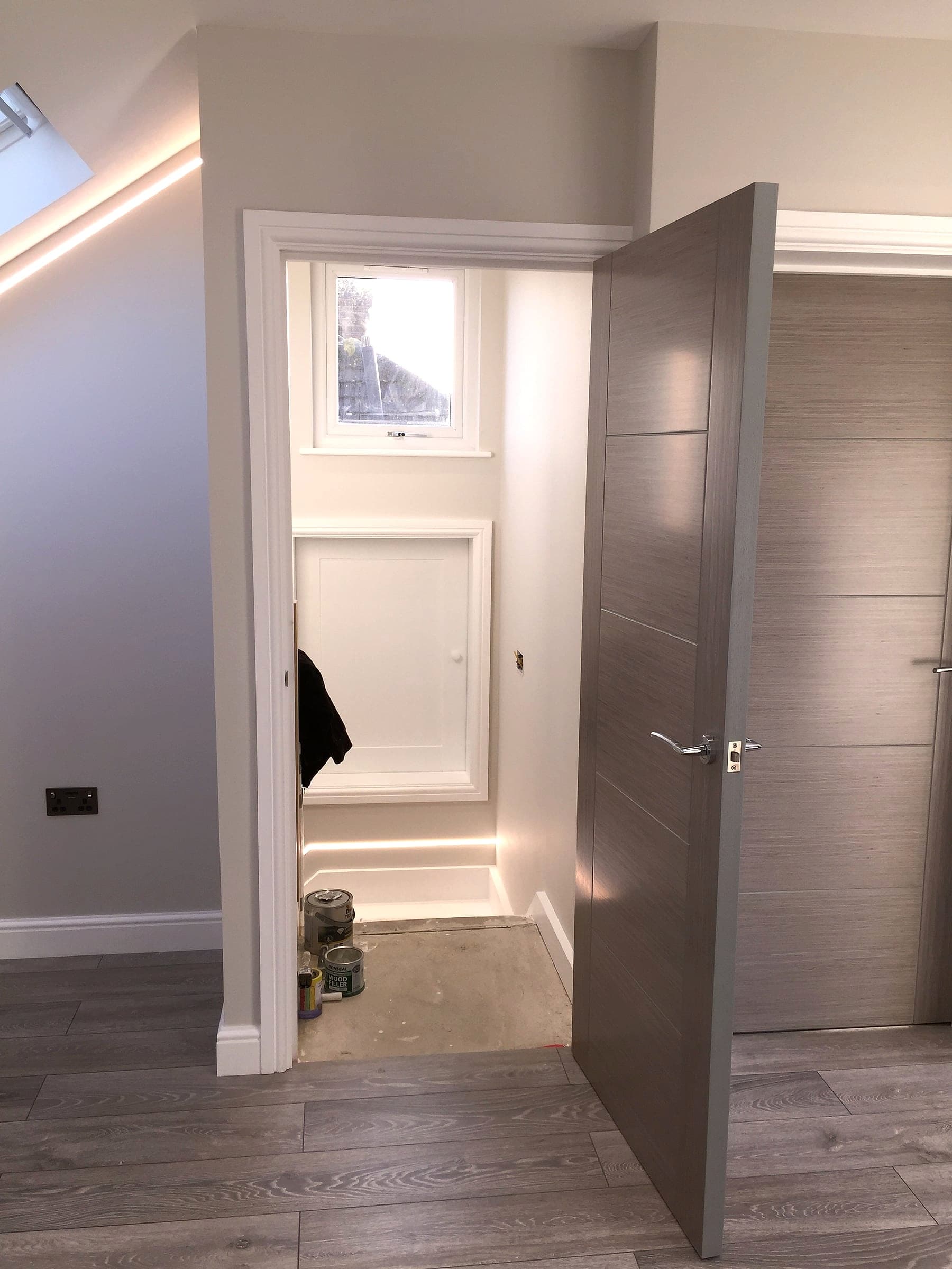 Finished landing with doors and eaves storage, London loft conversion