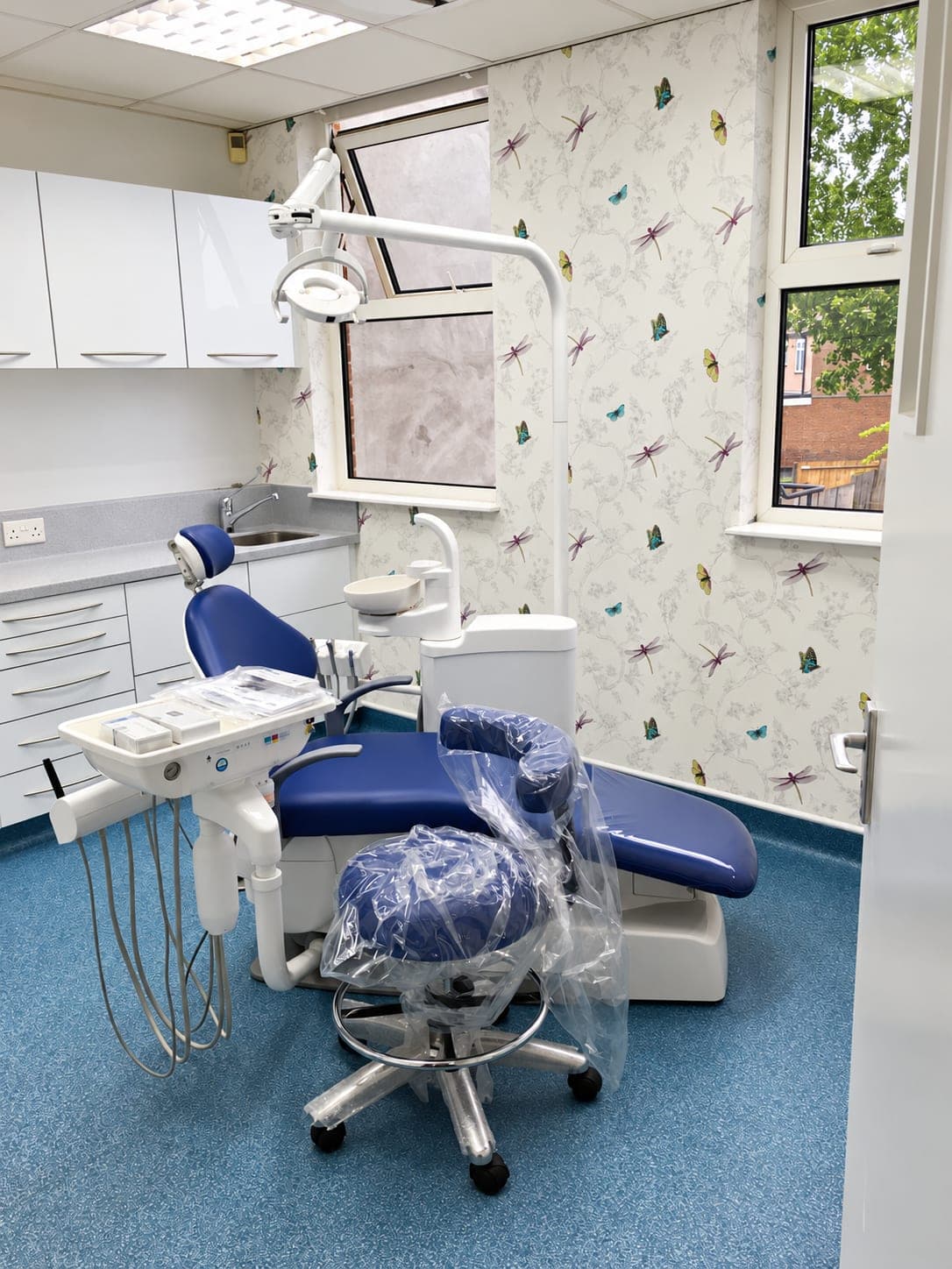 Surgery from the door with the chair, light and window beyond, Belmont Circle HA3