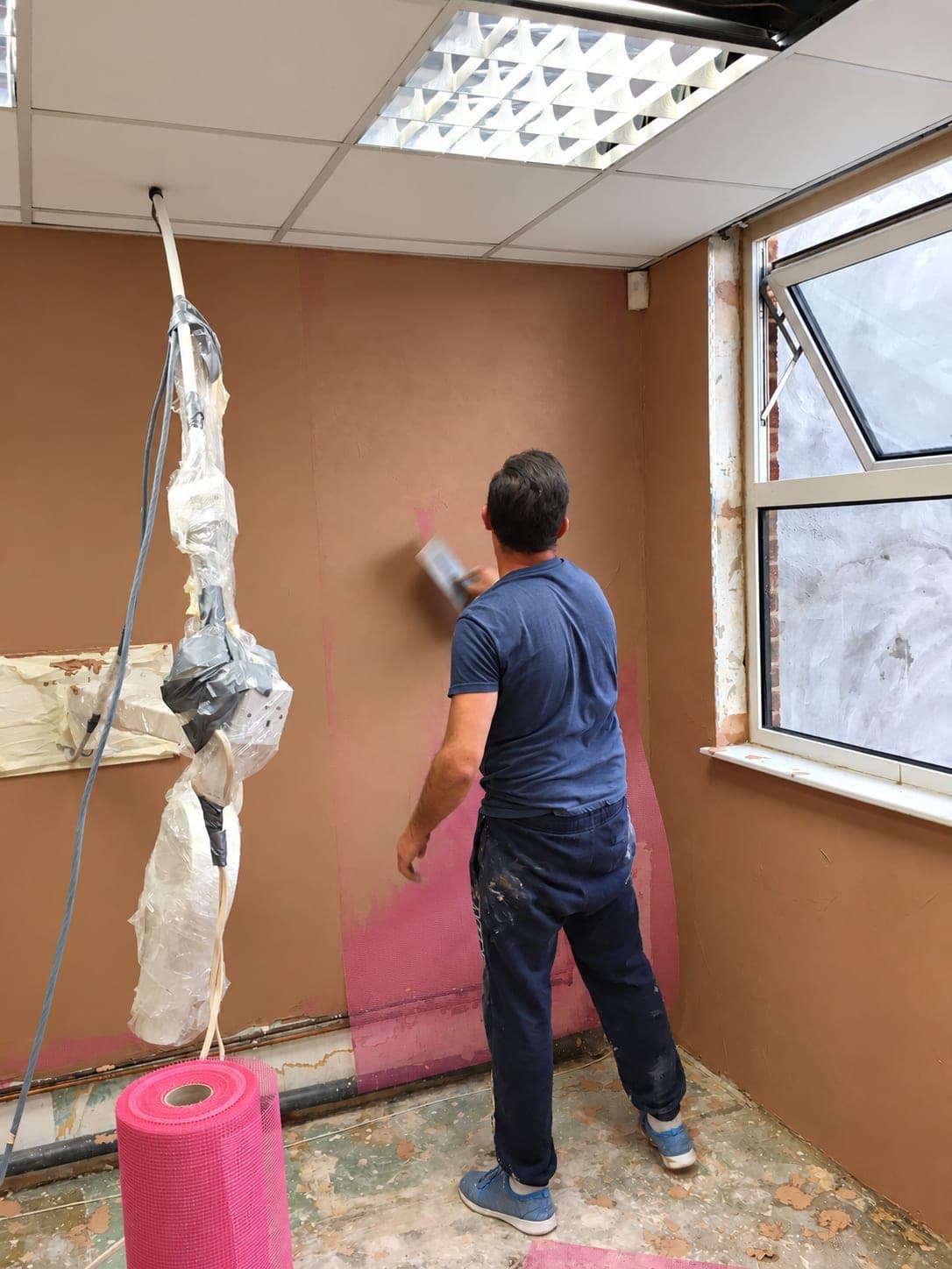 Walls being prepared and sealed before replastering, Belmont Circle HA3
