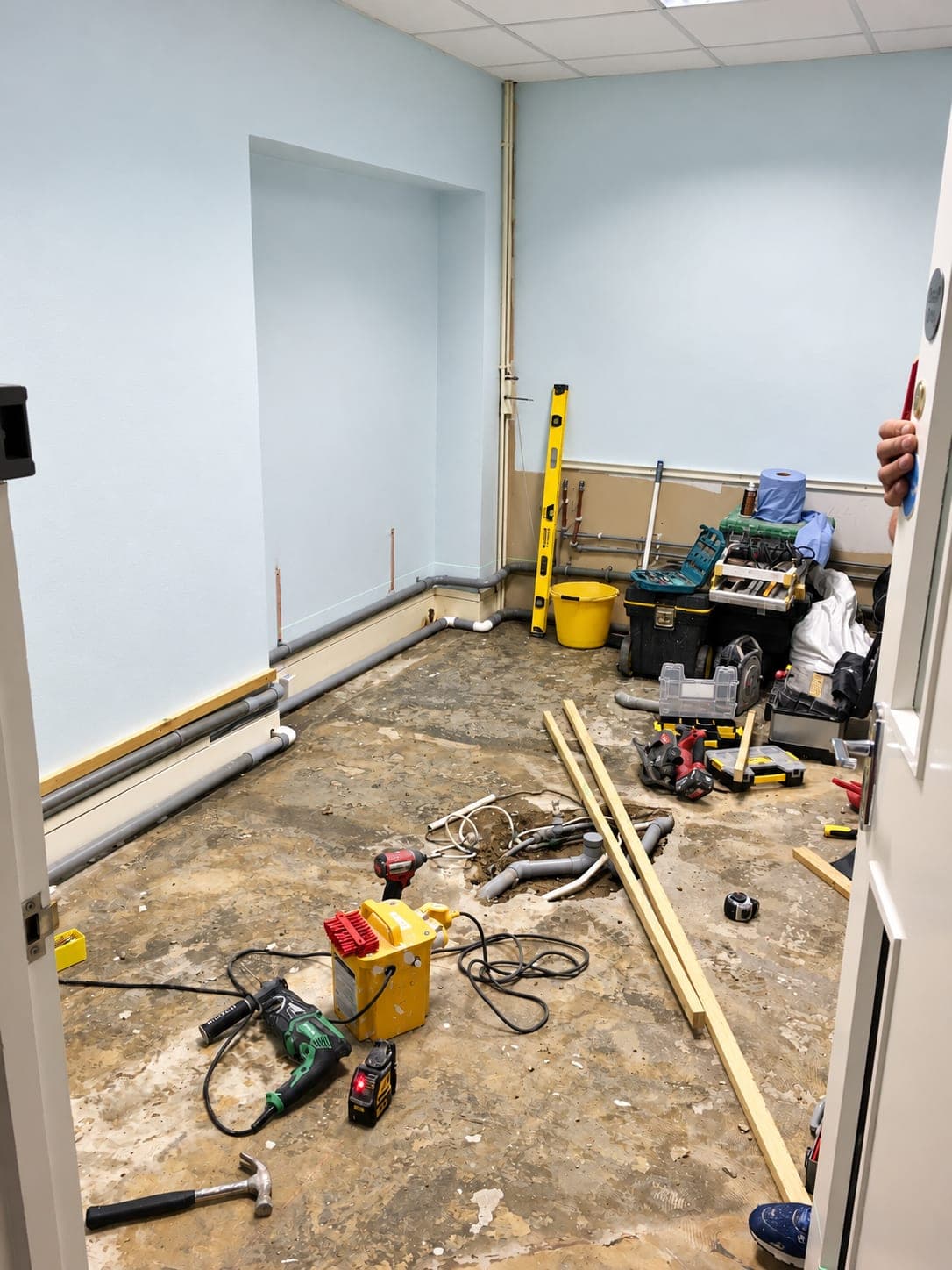 Room stripped out with the floor up and services exposed, Bishopsgate EC2