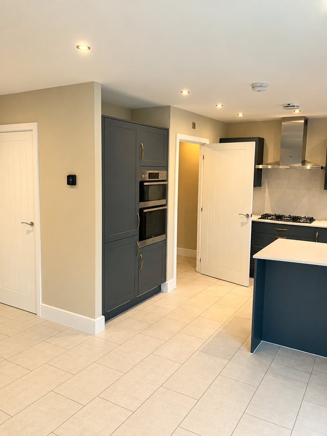 Looking through from the hall to the charcoal kitchen and oven tower, North Finchley N12