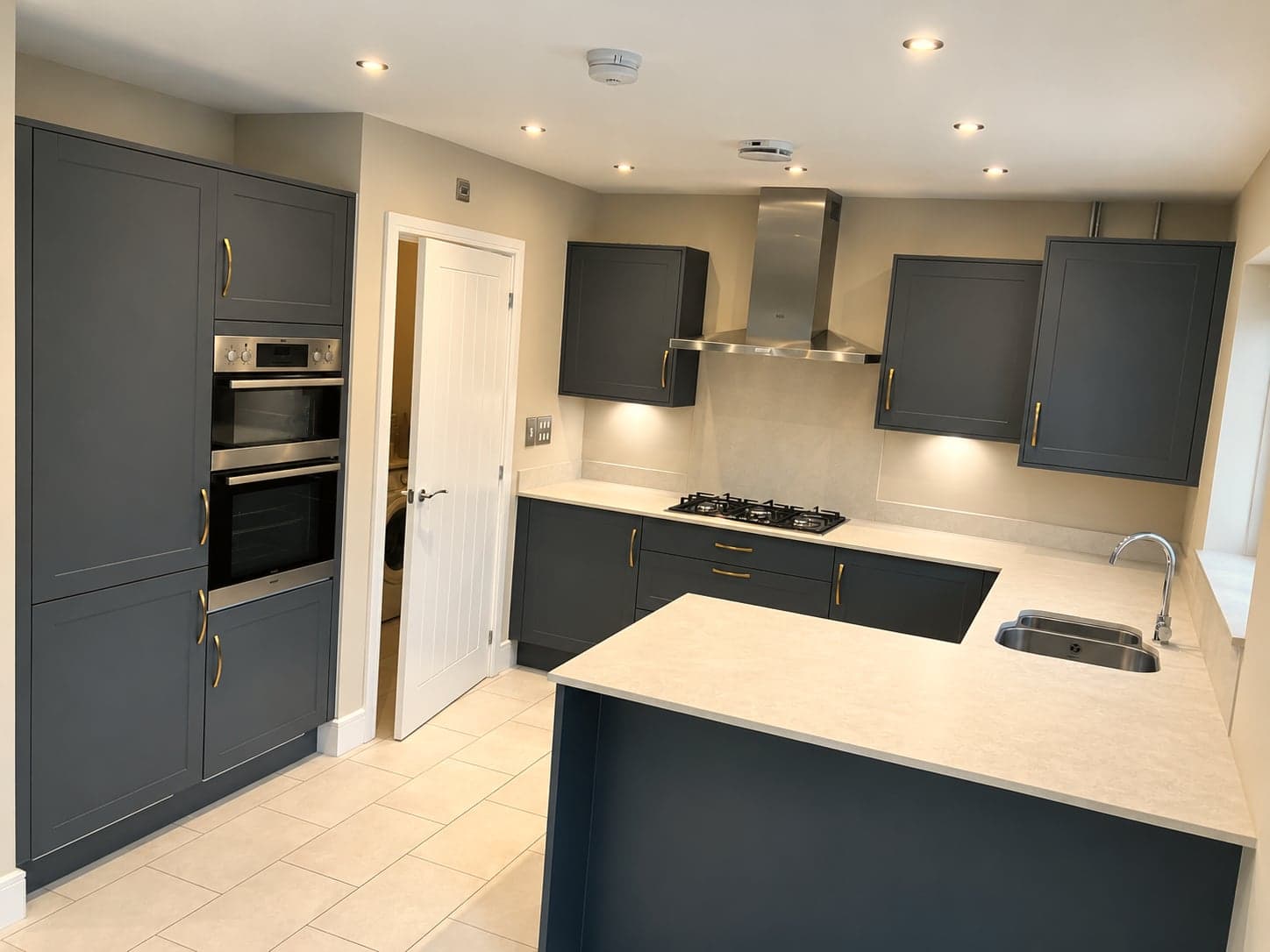 Charcoal shaker units with chimney extractor, oven tower and quartz-topped peninsula, North Finchley N12