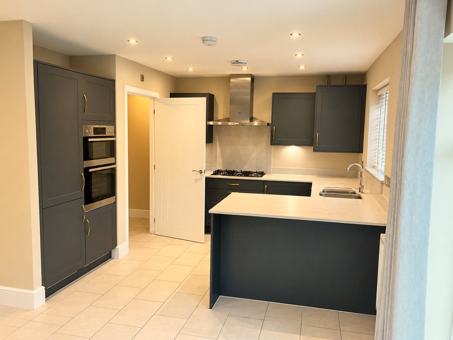 Charcoal shaker kitchen renovation with brass handles, North Finchley N12