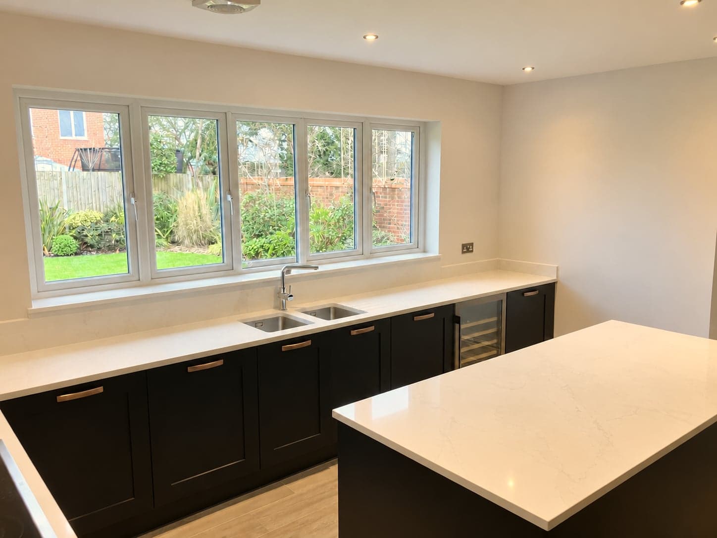 Window run with inset sink, quartz worktop and integrated wine cooler, Notting Hill W11