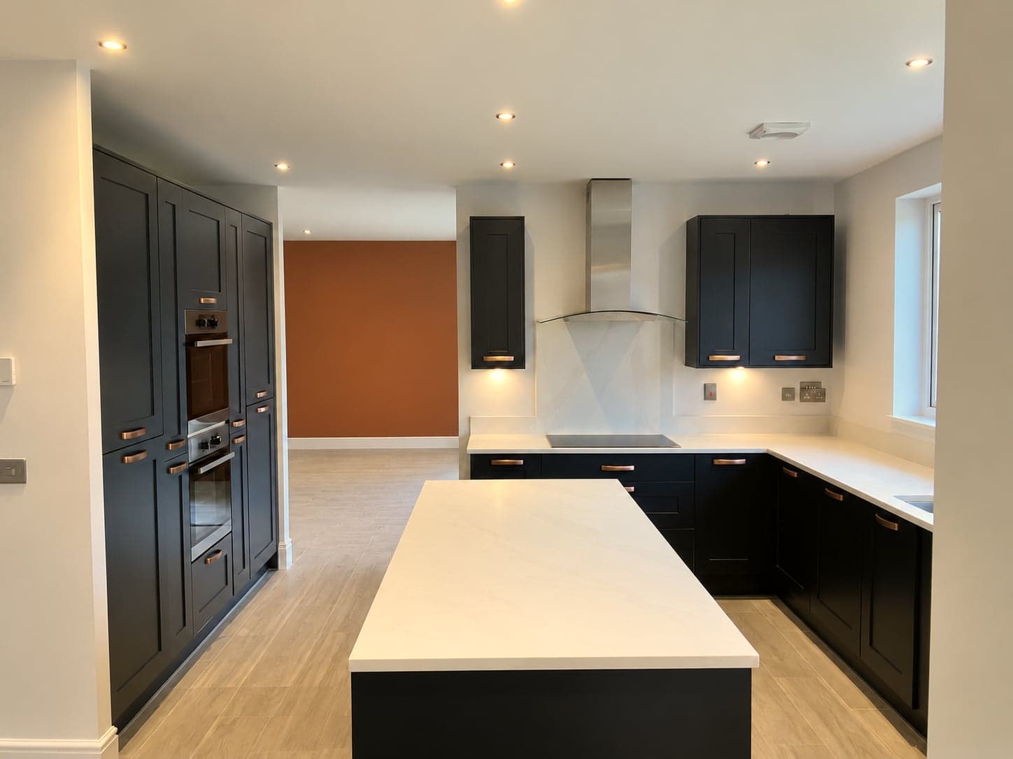 Island, oven tower and hob run seen from the dining area, Notting Hill W11