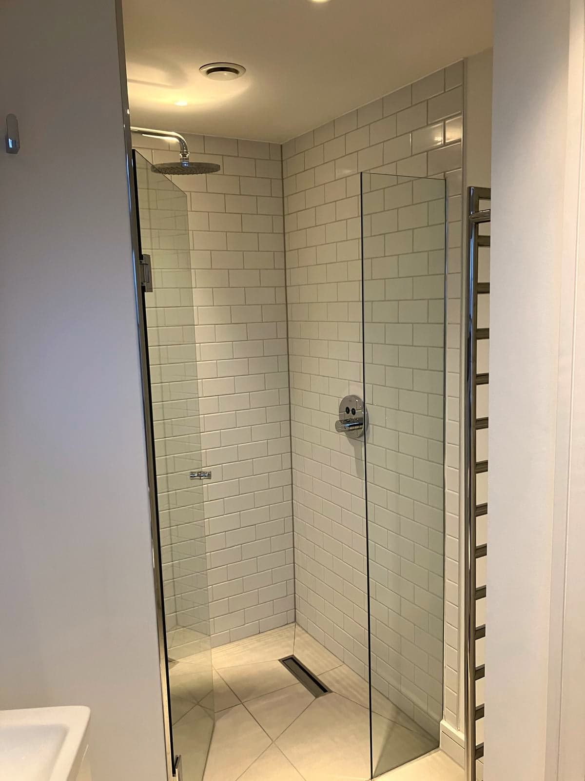 Walk-in shower with frameless glass, rainfall head and linear drain, Camden NW1