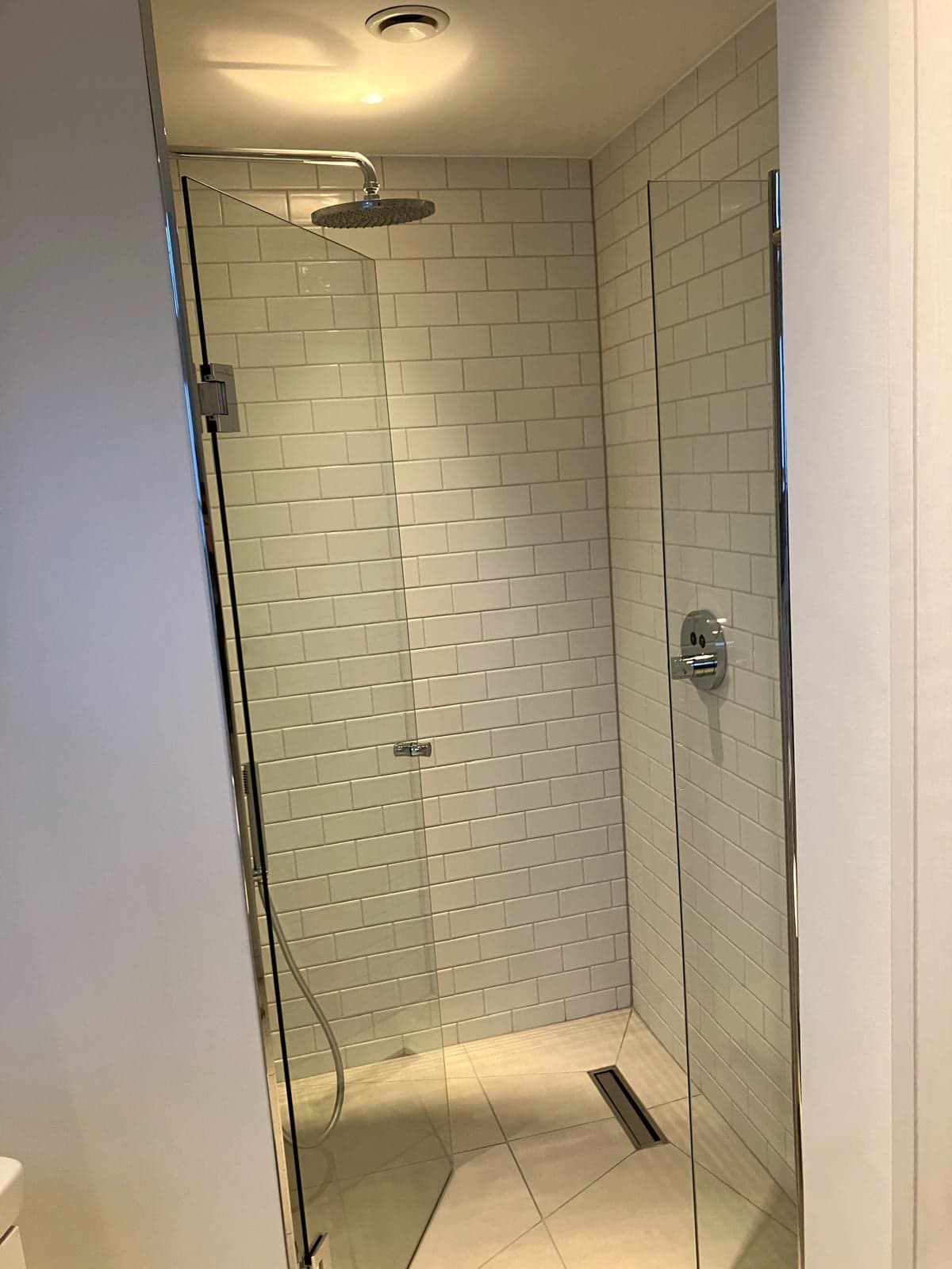 Shower enclosure with metro tiling and chrome fittings, Camden NW1