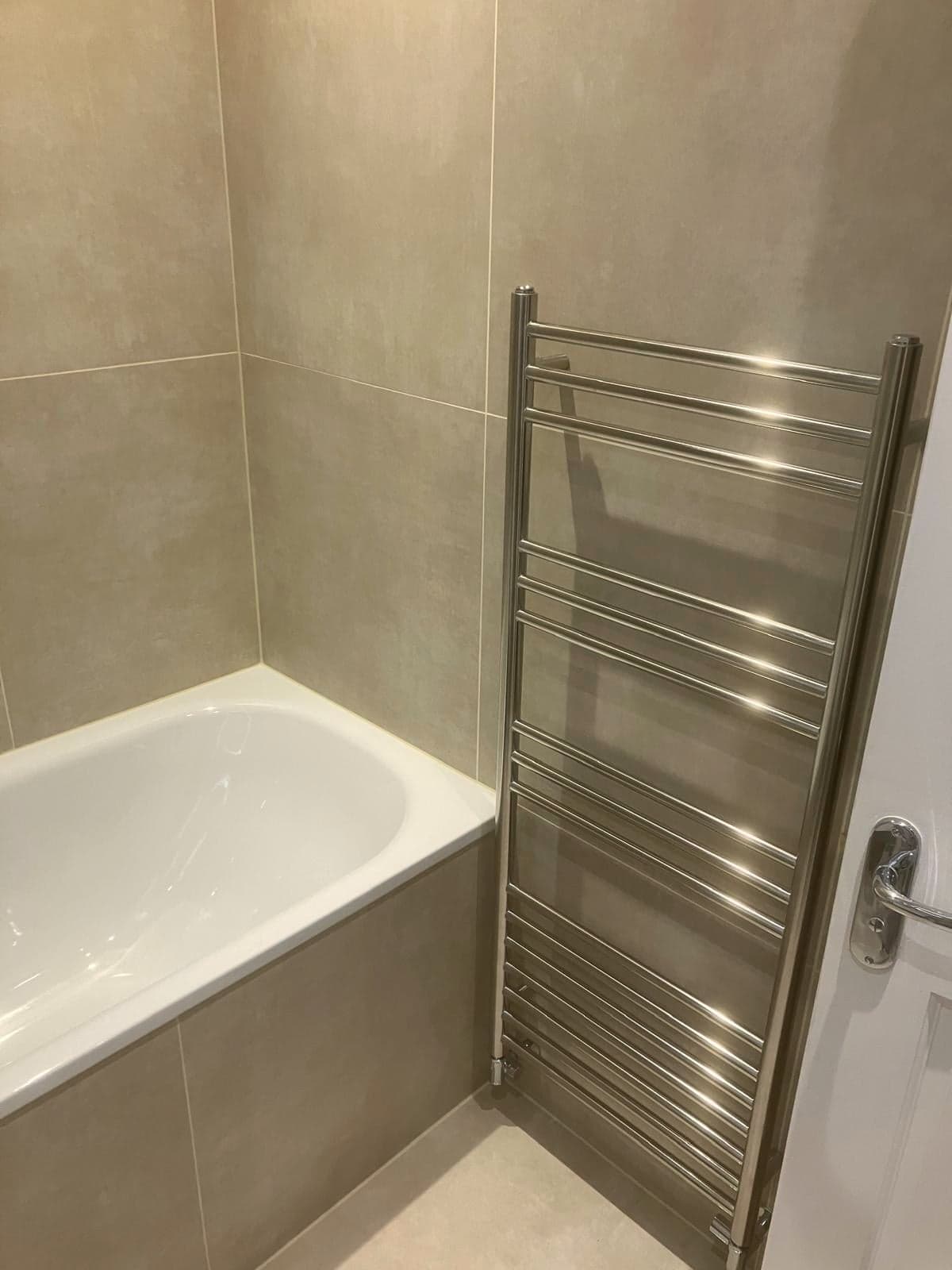 Chrome ladder towel rail alongside the bath, Streatham Hill SW2