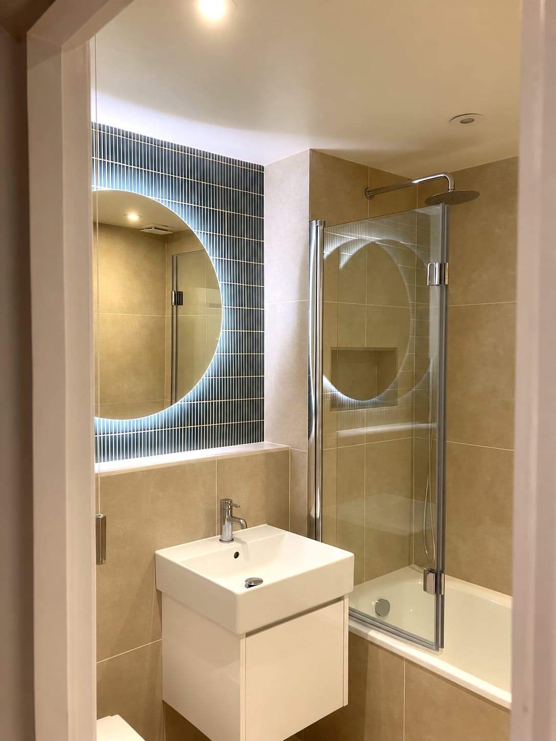 Mosaic feature panel, backlit mirror and bath screen above the basin, Streatham Hill SW2