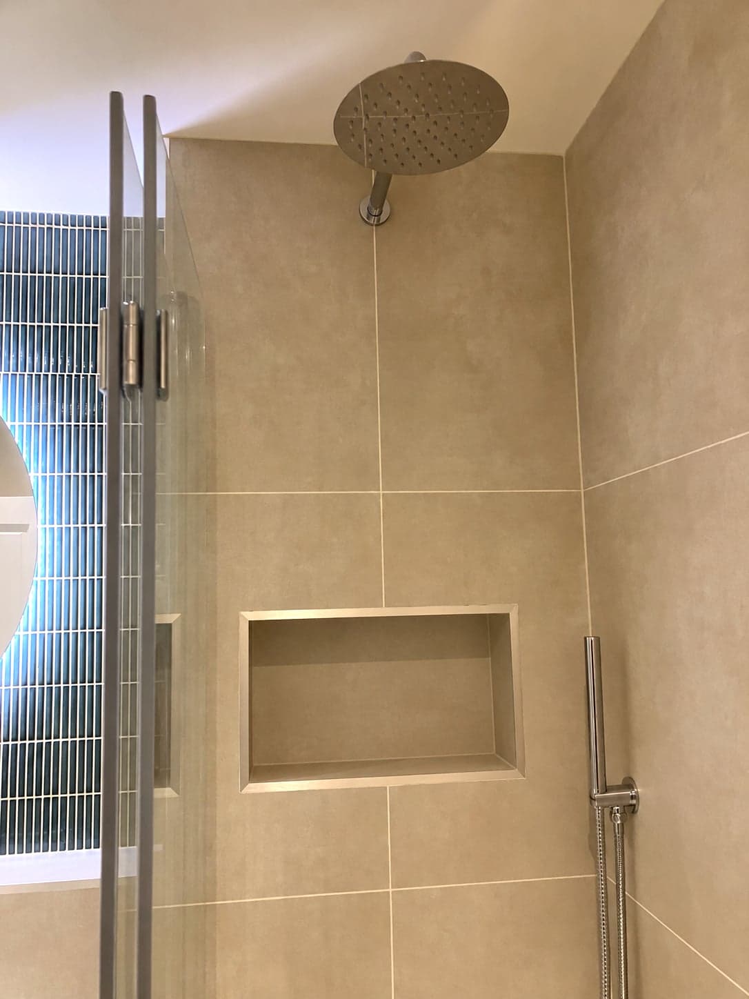 Rainfall shower head over the bath with a recessed niche and glass screen, Streatham Hill SW2