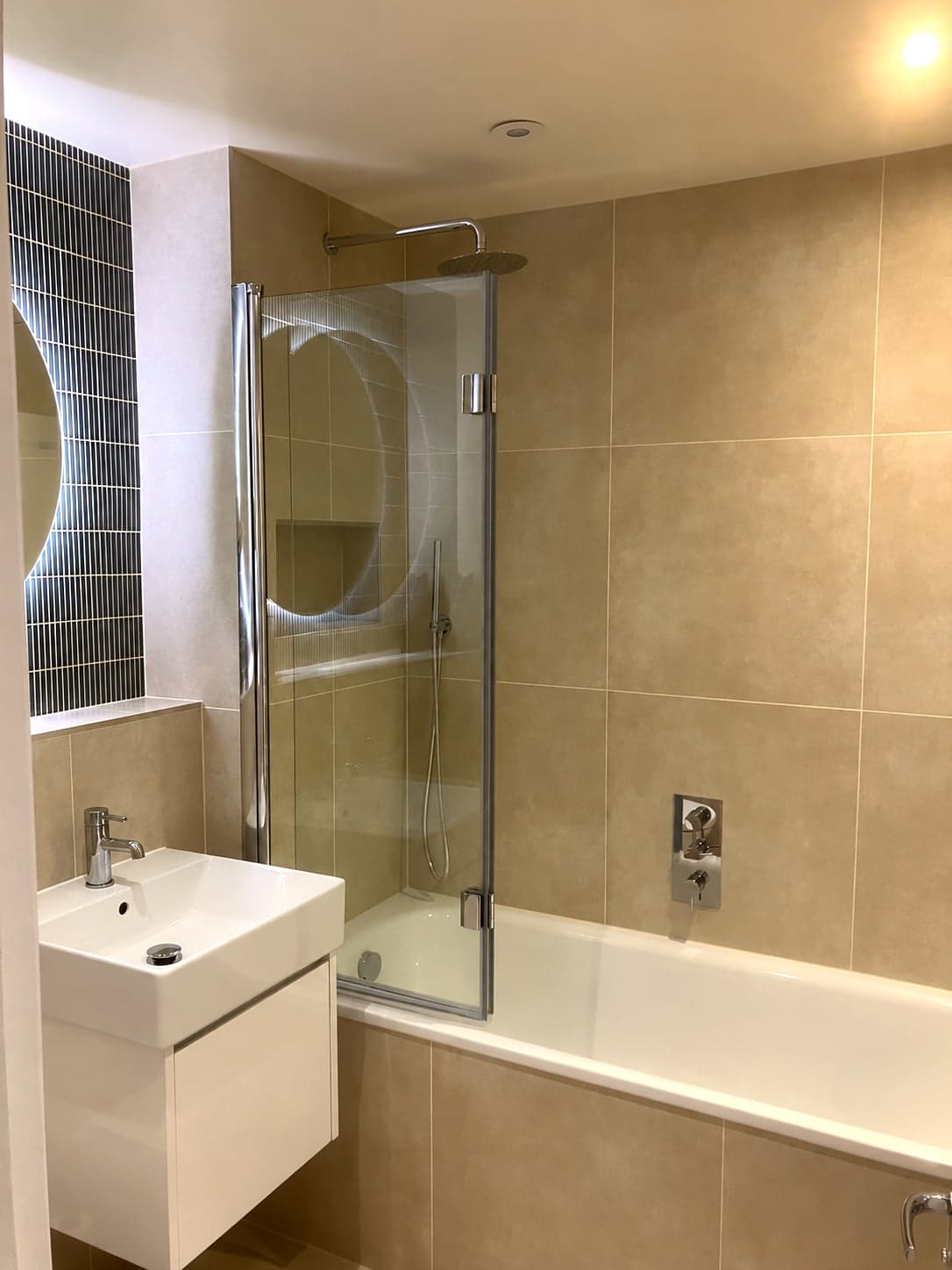 Basin and bath with the teal mosaic panel behind the mirror, Streatham Hill SW2