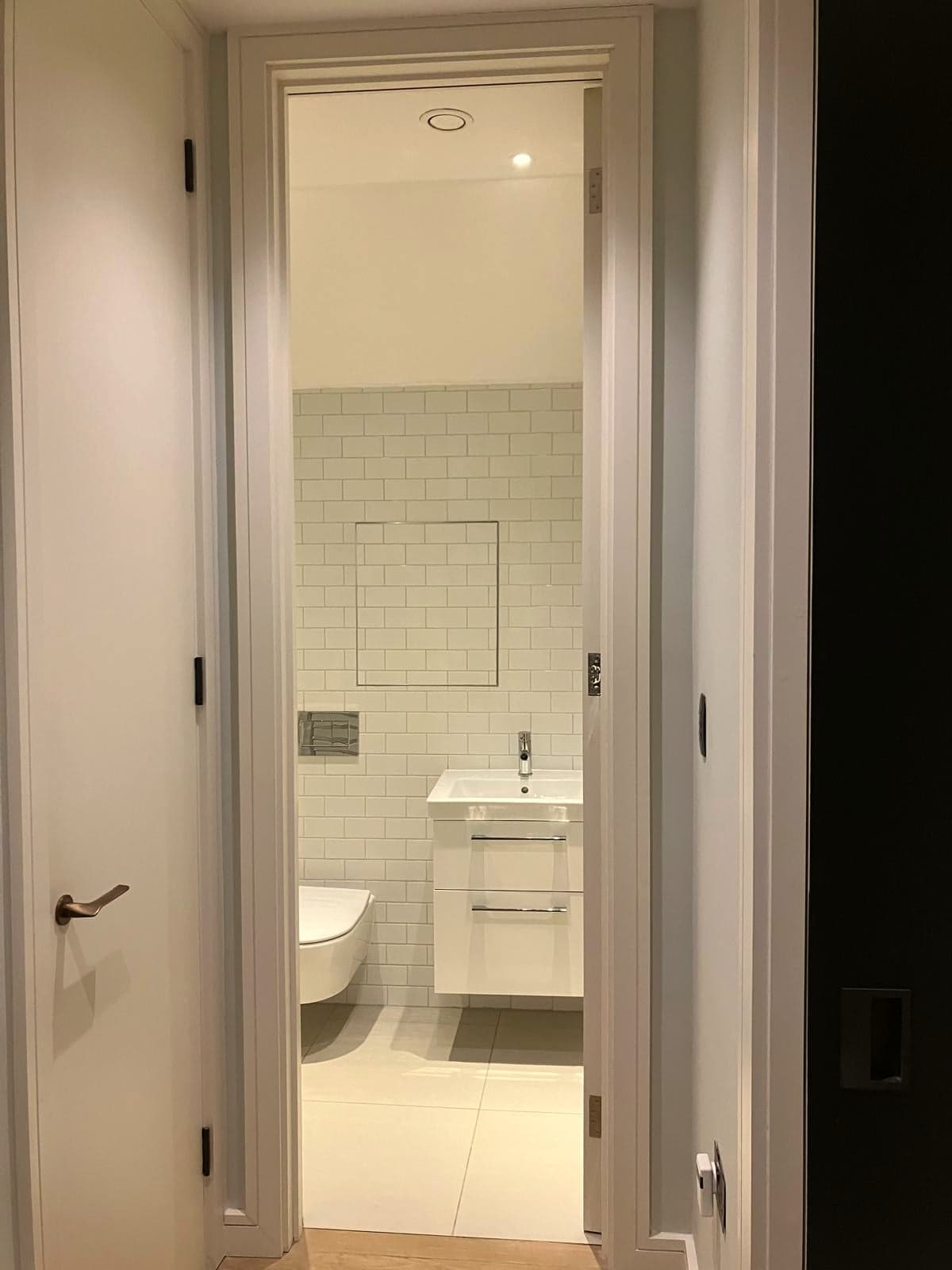 Looking into the finished en-suite from the bedroom door, Marylebone W1