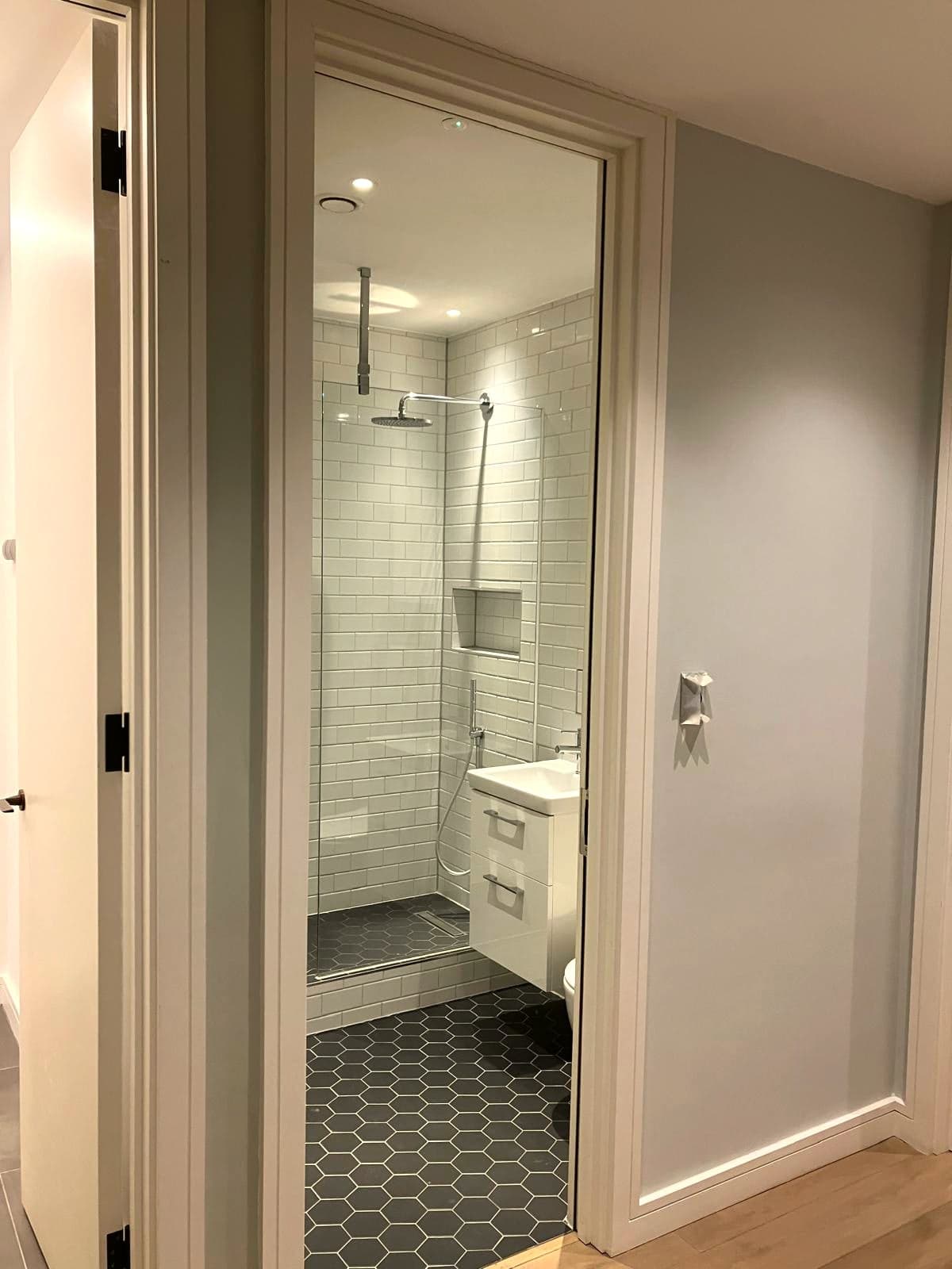 Doorway view of the walk-in shower and vanity, Marylebone W1