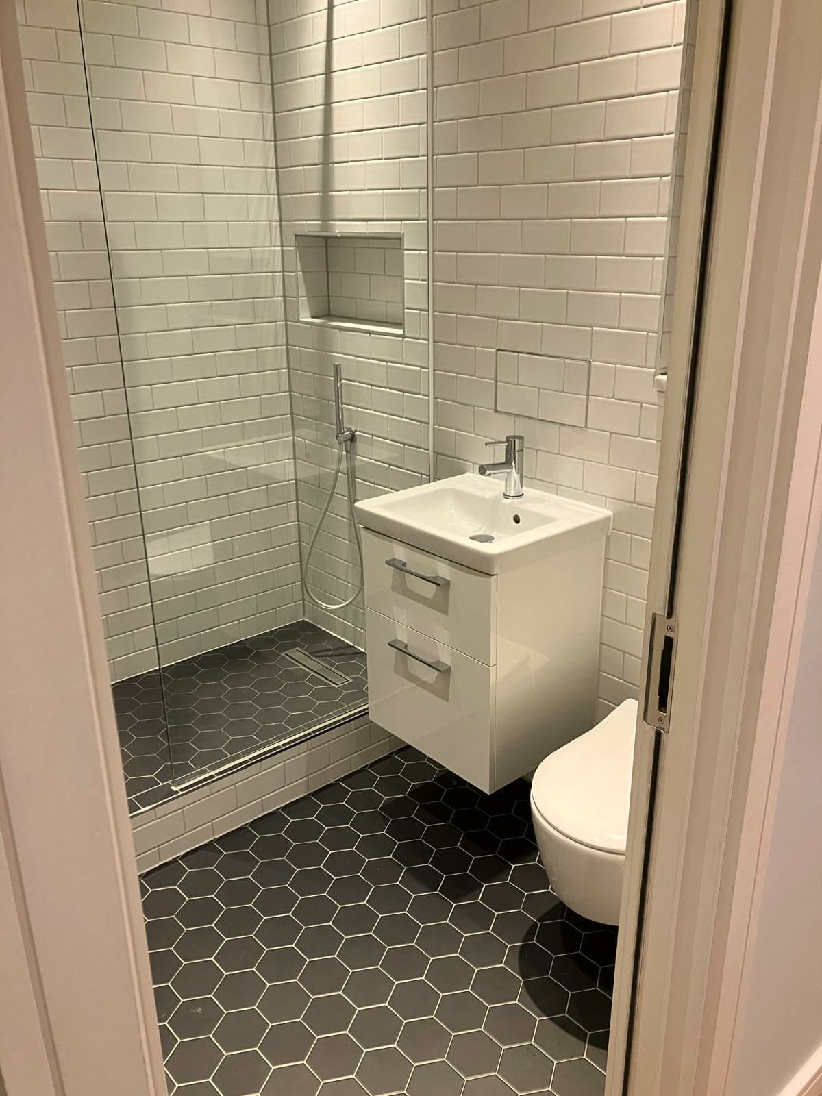 En-suite interior with shower, vanity and WC in one view, Marylebone W1