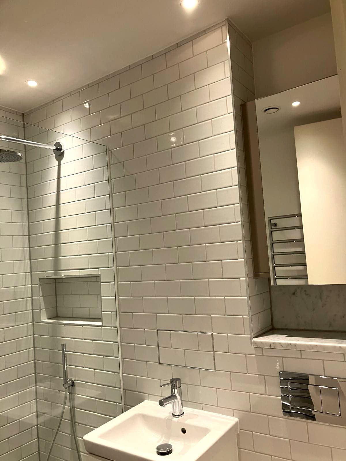 Shower area with recessed niche and the mirror above the basin, Marylebone W1
