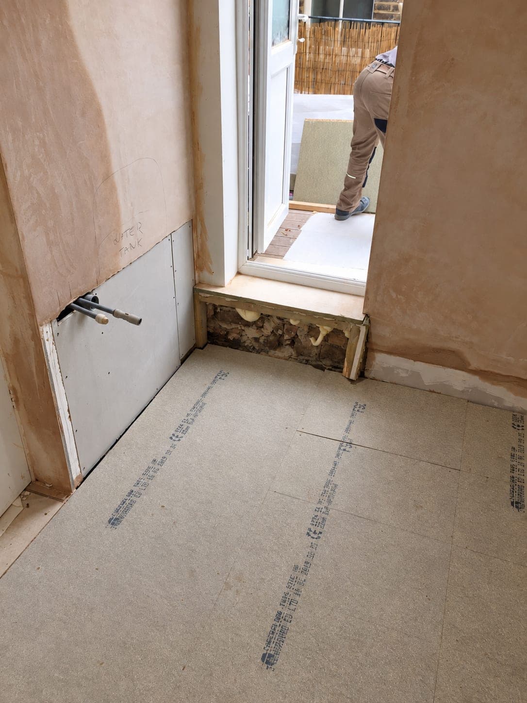 Floor boarded out and plastering finished before the units go in, Chiswick W4
