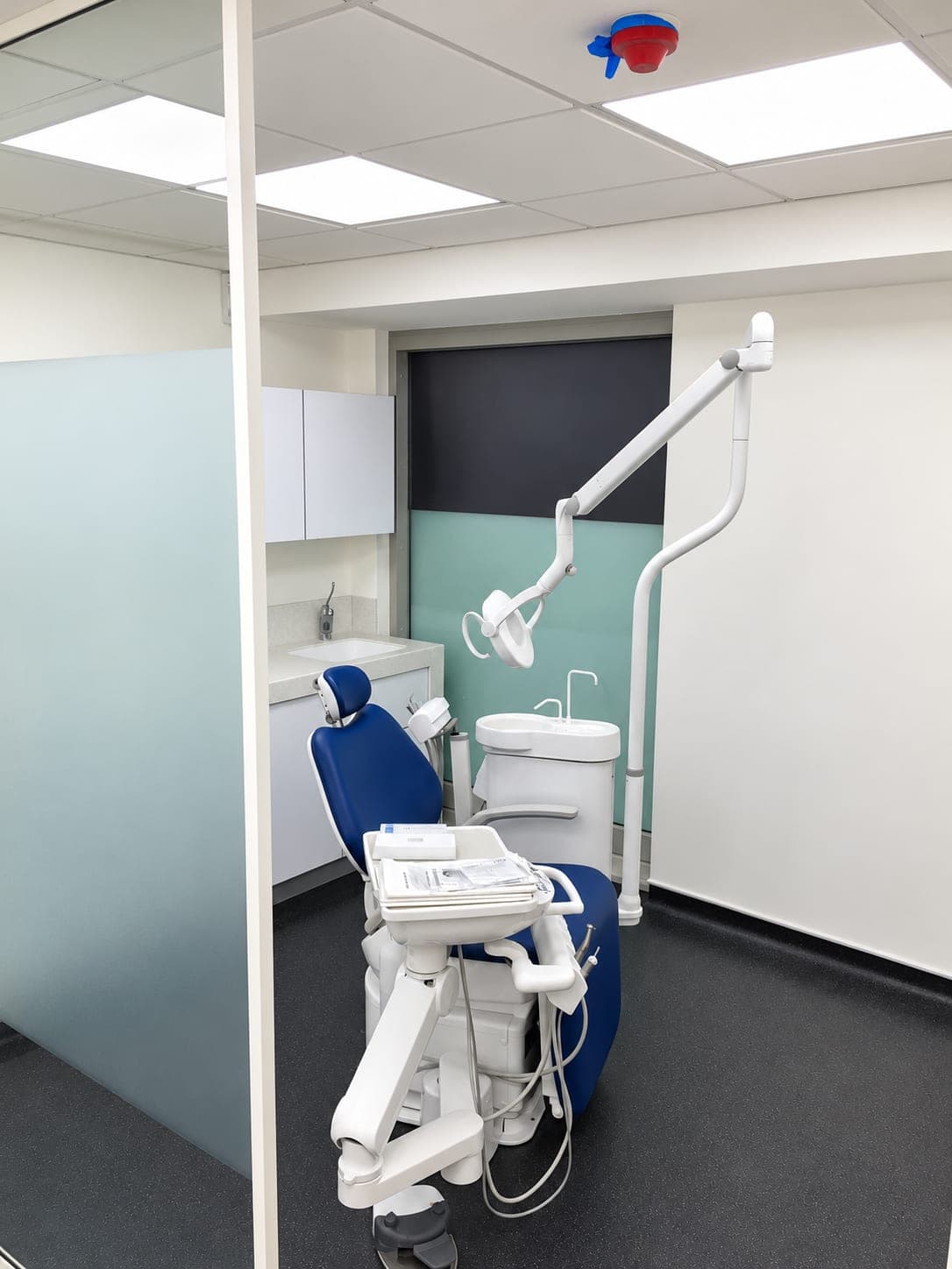 Treatment bay seen past the frosted glass screen dividing the surgeries, Docklands E14