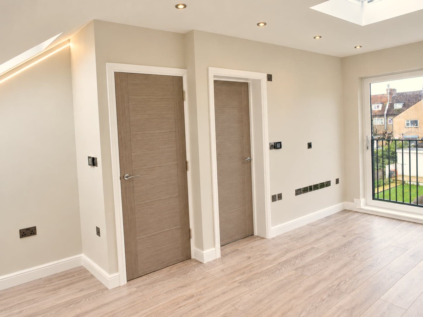 Two internal doors off the loft landing with the balcony glazing to the right, Hampstead NW3