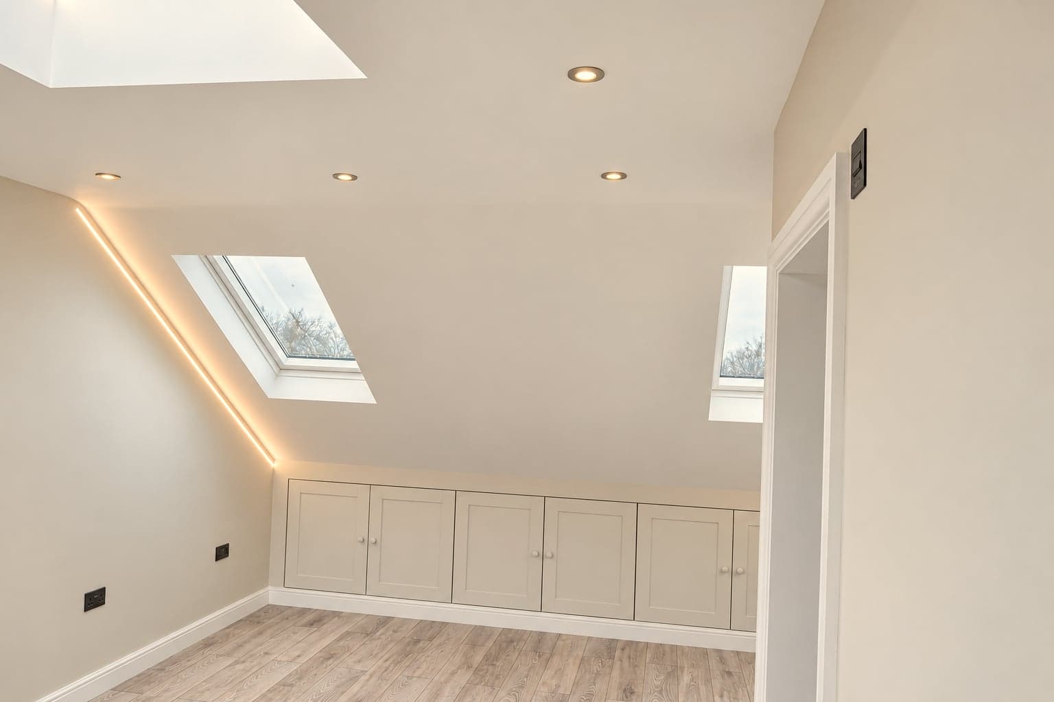Dormer with roof window, eaves storage and concealed lighting along the ceiling, Hampstead NW3