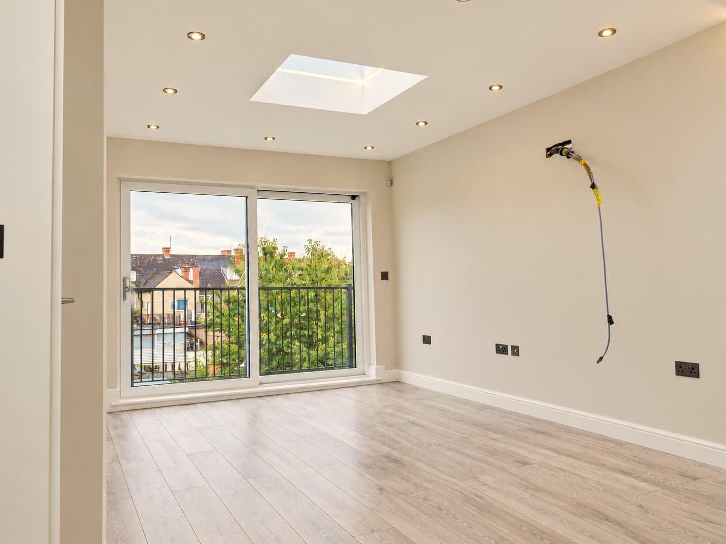 Loft bedroom with rooflight, balcony doors and new oak flooring, Hampstead NW3