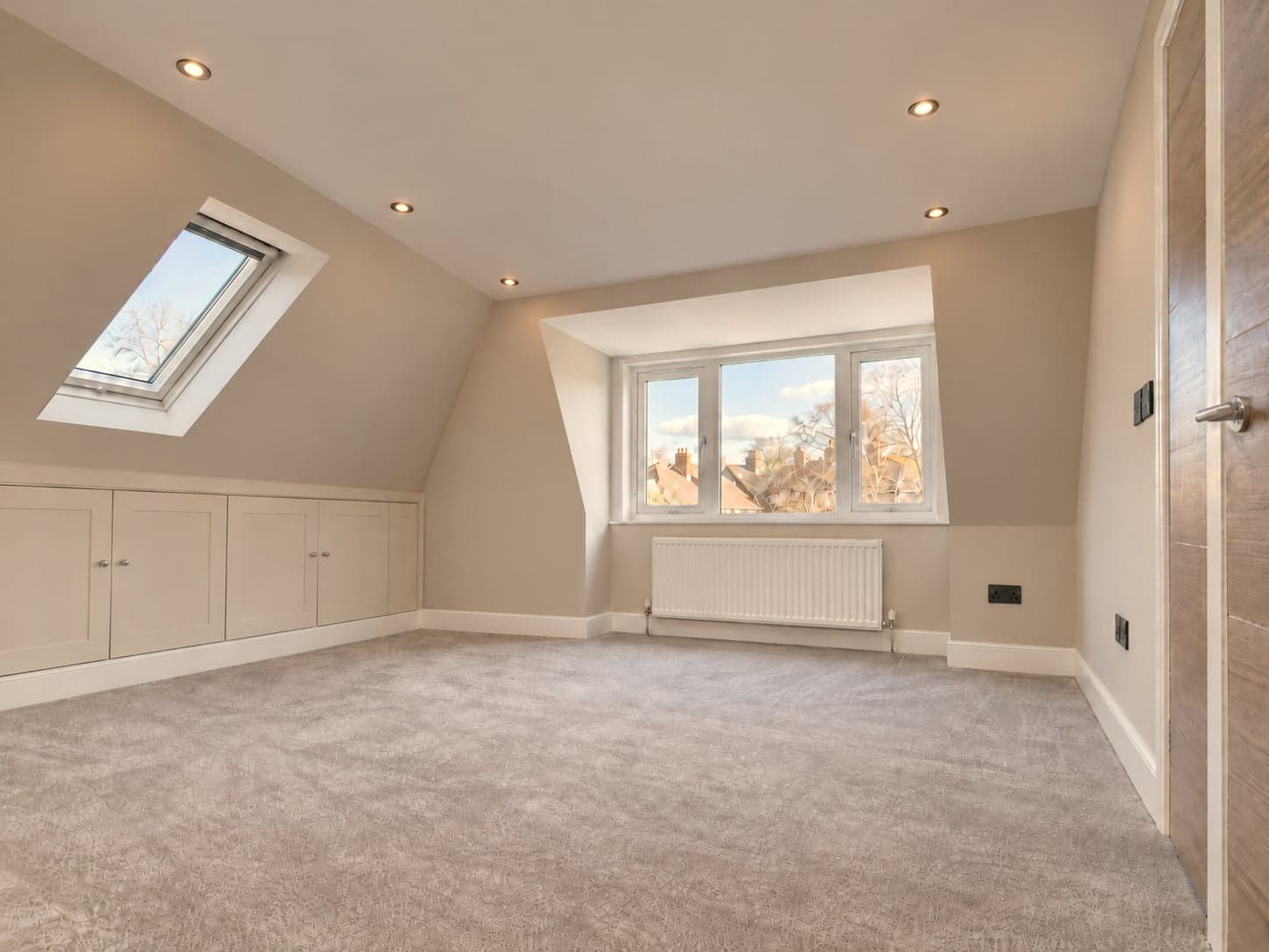 Loft bedroom with rear dormer window, front roof window and built-in eaves storage, dormer loft conversion in Rickmansworth WD3