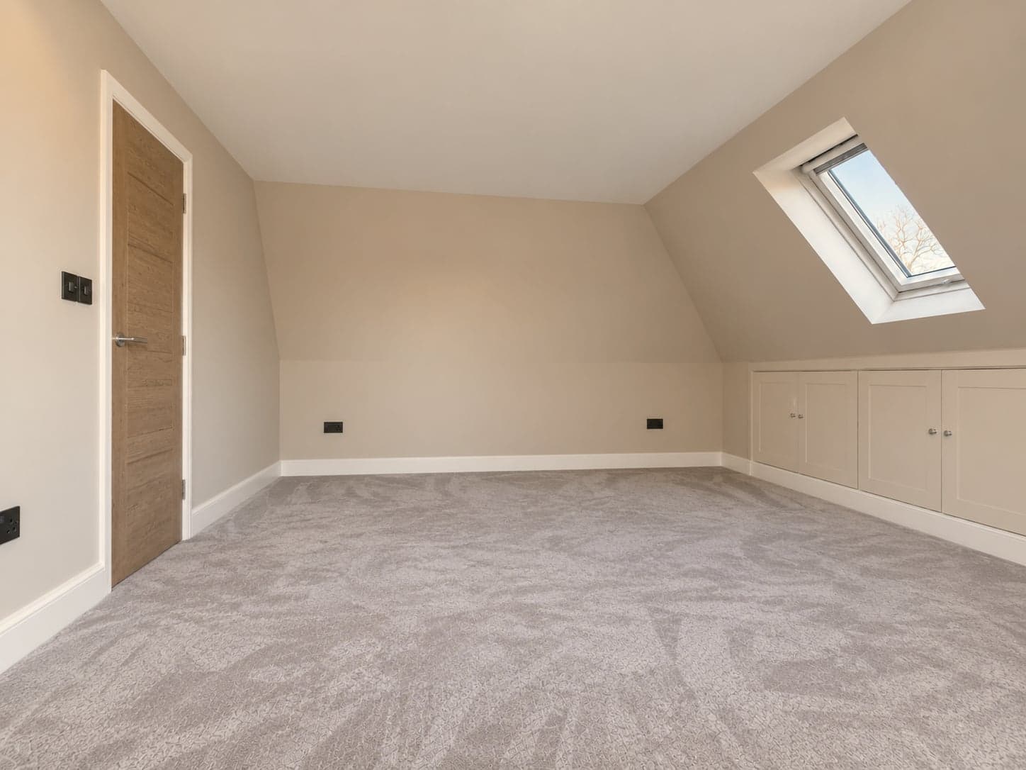 Loft room from the dormer end with the oak door and eaves cupboards, Rickmansworth WD3