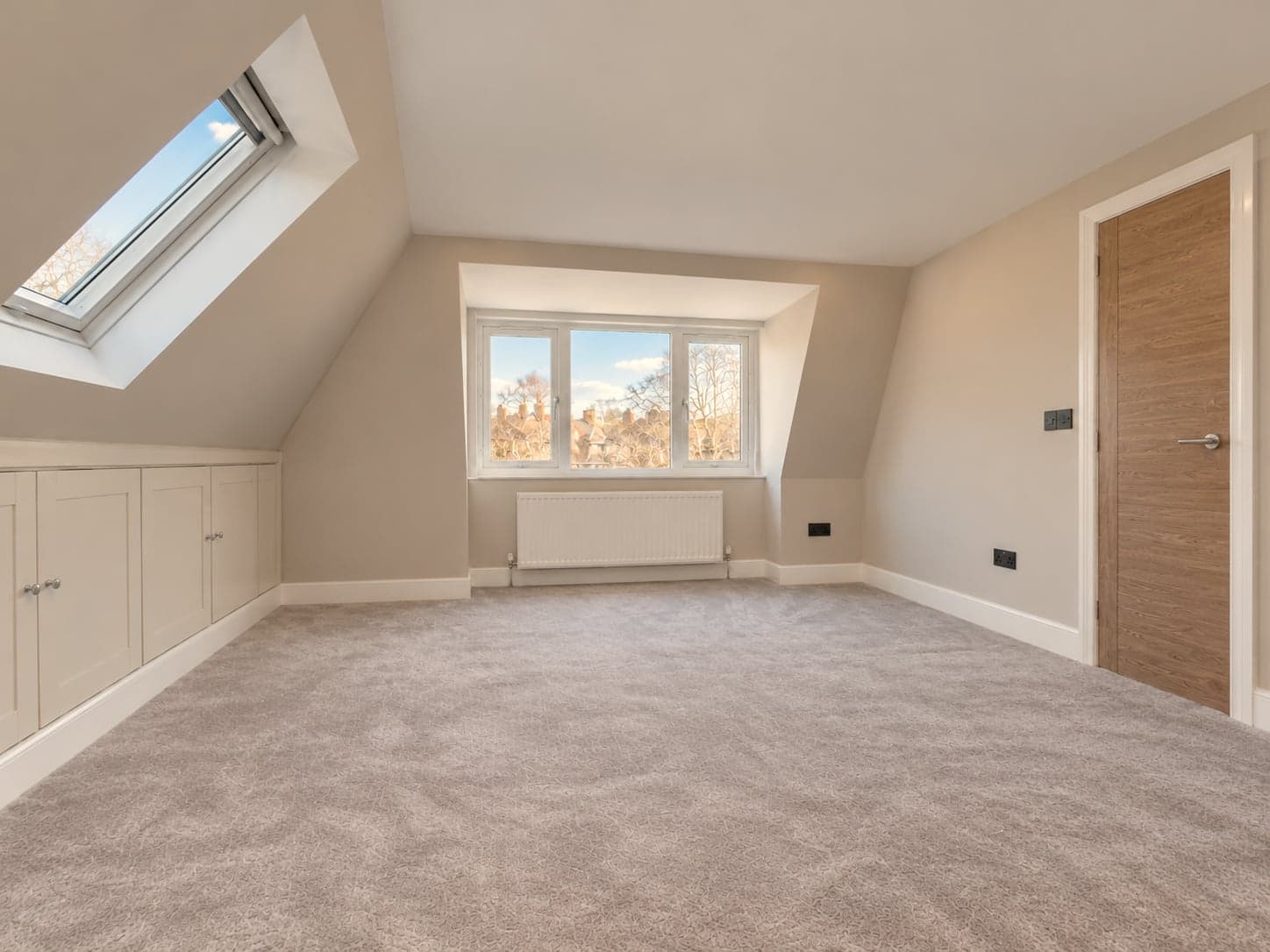 Sloping ceiling with roof window above the dormer and built-in eaves storage, Rickmansworth WD3