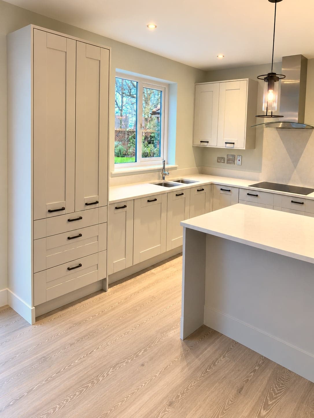 Window run with inset sink and the island alongside, Shepherds Bush W12