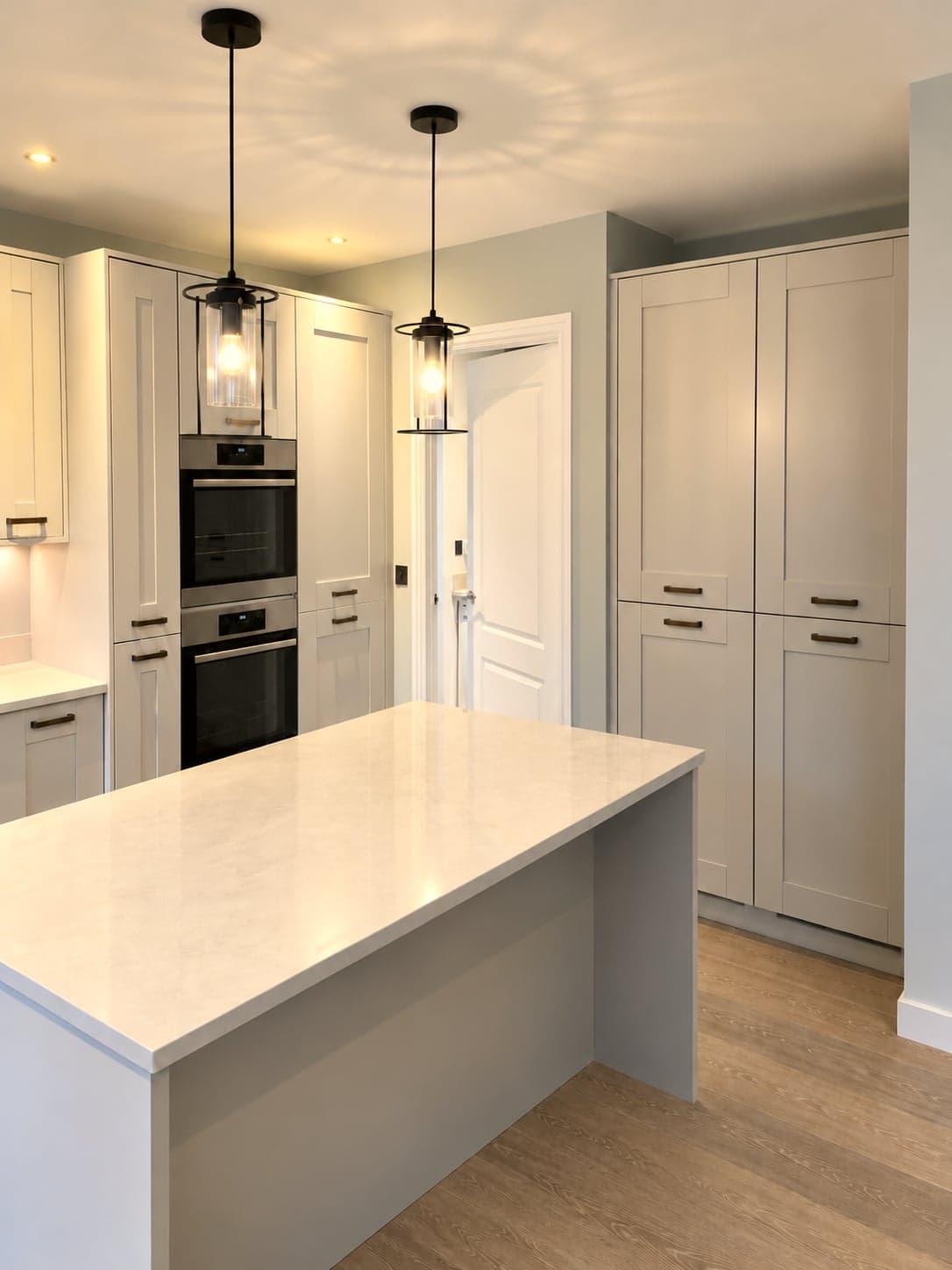 Island, pendants and oven tower with wood-effect flooring throughout, Shepherds Bush W12