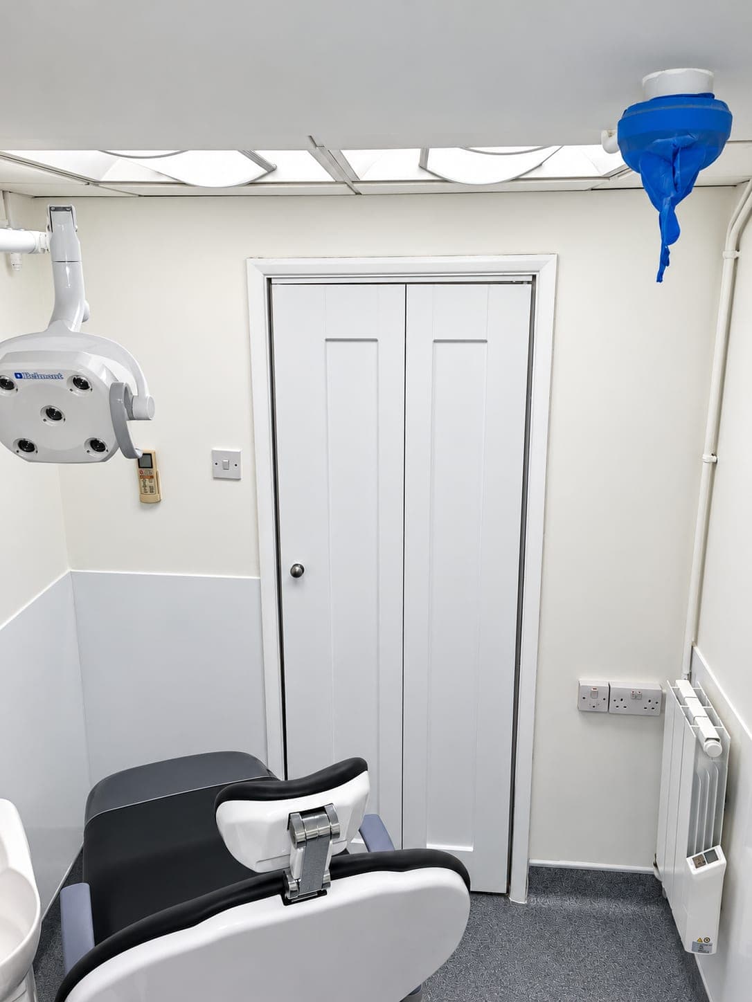 Surgery corner with the chair, operating light and new door, Finchley N3