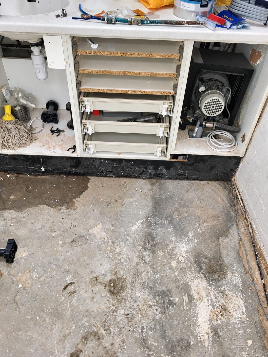 Under-cabinet services exposed during the strip-out, Finchley N3