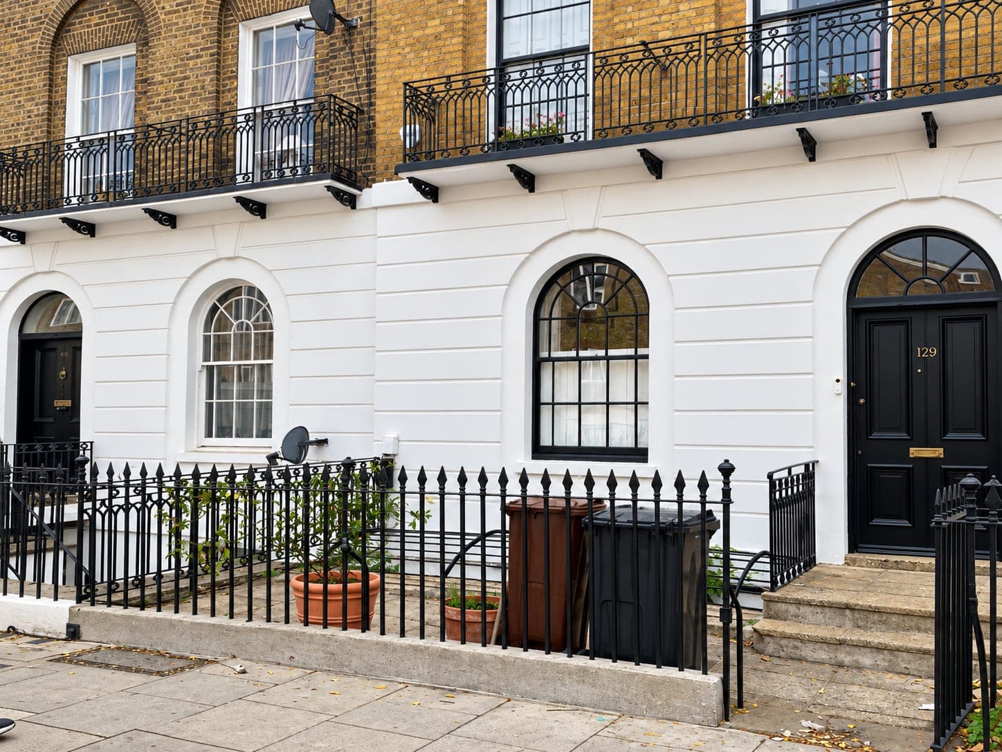 Terrace elevation from the pavement, stucco and railings restored, Shepherdess Walk N1