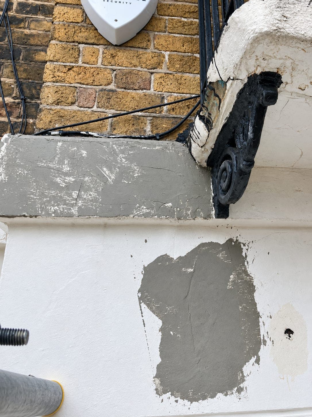 New render patch let into the elevation and left to cure, Shepherdess Walk N1