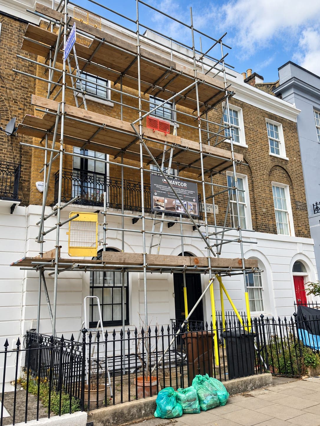Scaffold up across the terrace during the facade works, Shepherdess Walk N1